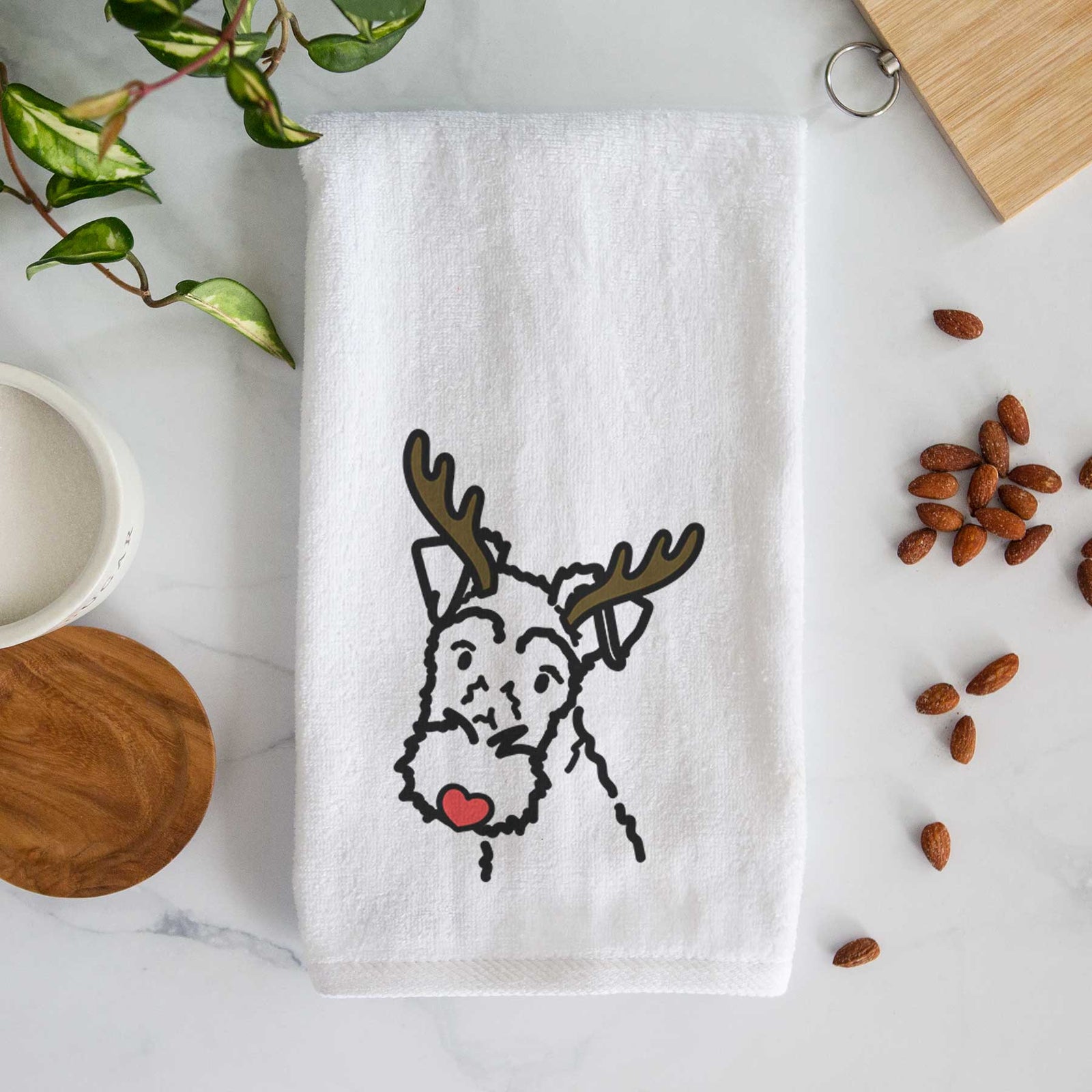 Minimalist line drawing of a Wire Fox Terrier with reindeer antlers and a red nose on a decorative hand towel