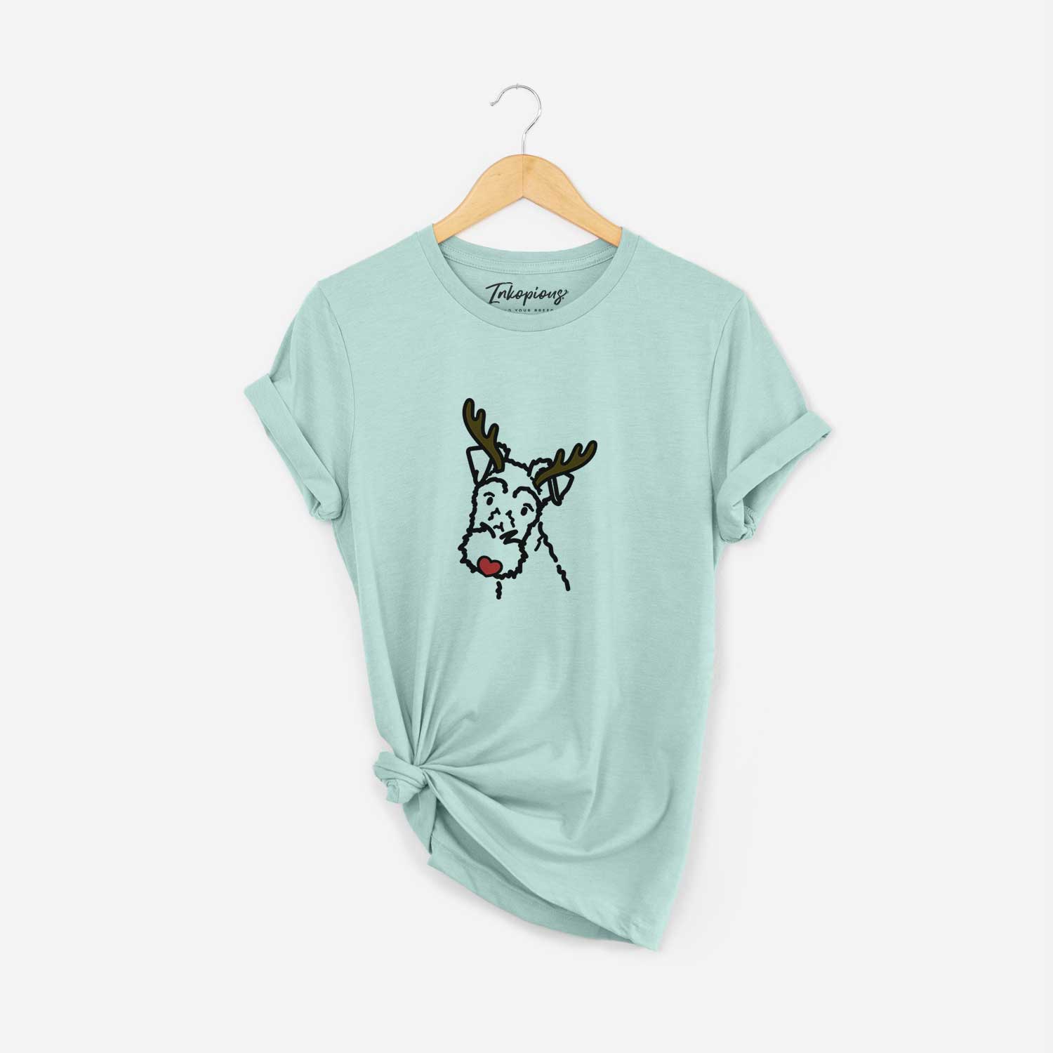 Minimalist line drawing of a Wire Fox Terrier with reindeer antlers and a red nose on a Heather Sage Unisex crewneck