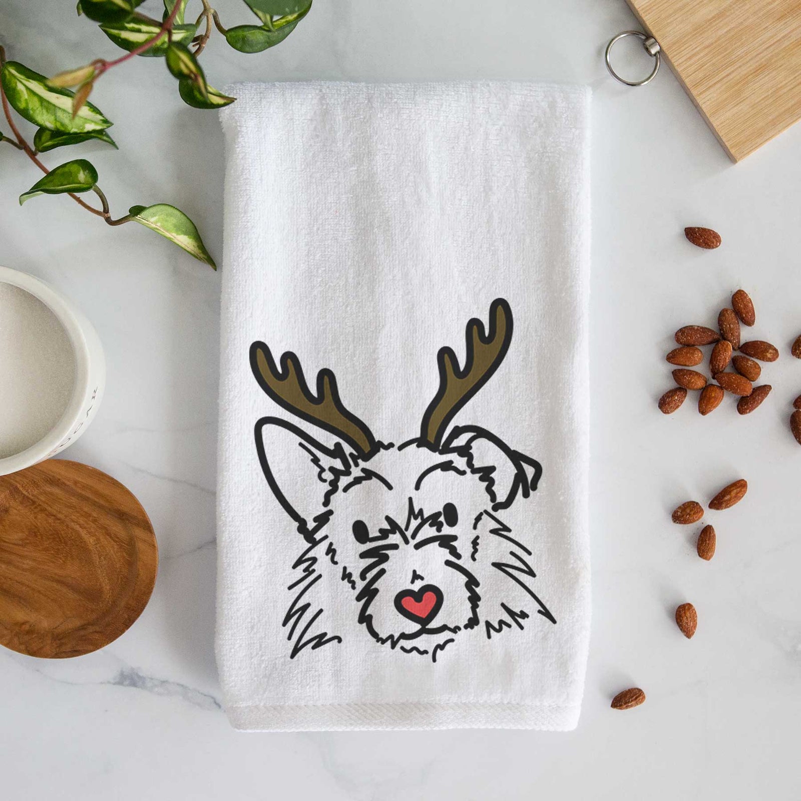 Minimalist line drawing of Ziggy the Terrier Mix with reindeer antlers and a red nose on a decorative hand towel