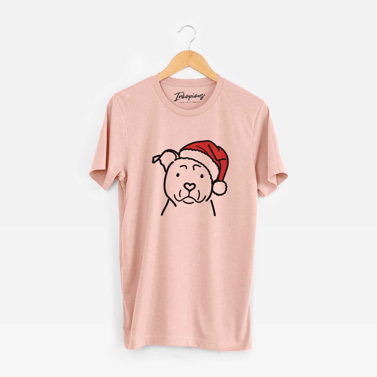 Minimalist line drawing of an American Staffordshire Terrier wearing a Santa hat on a Peach Unisex crewneck