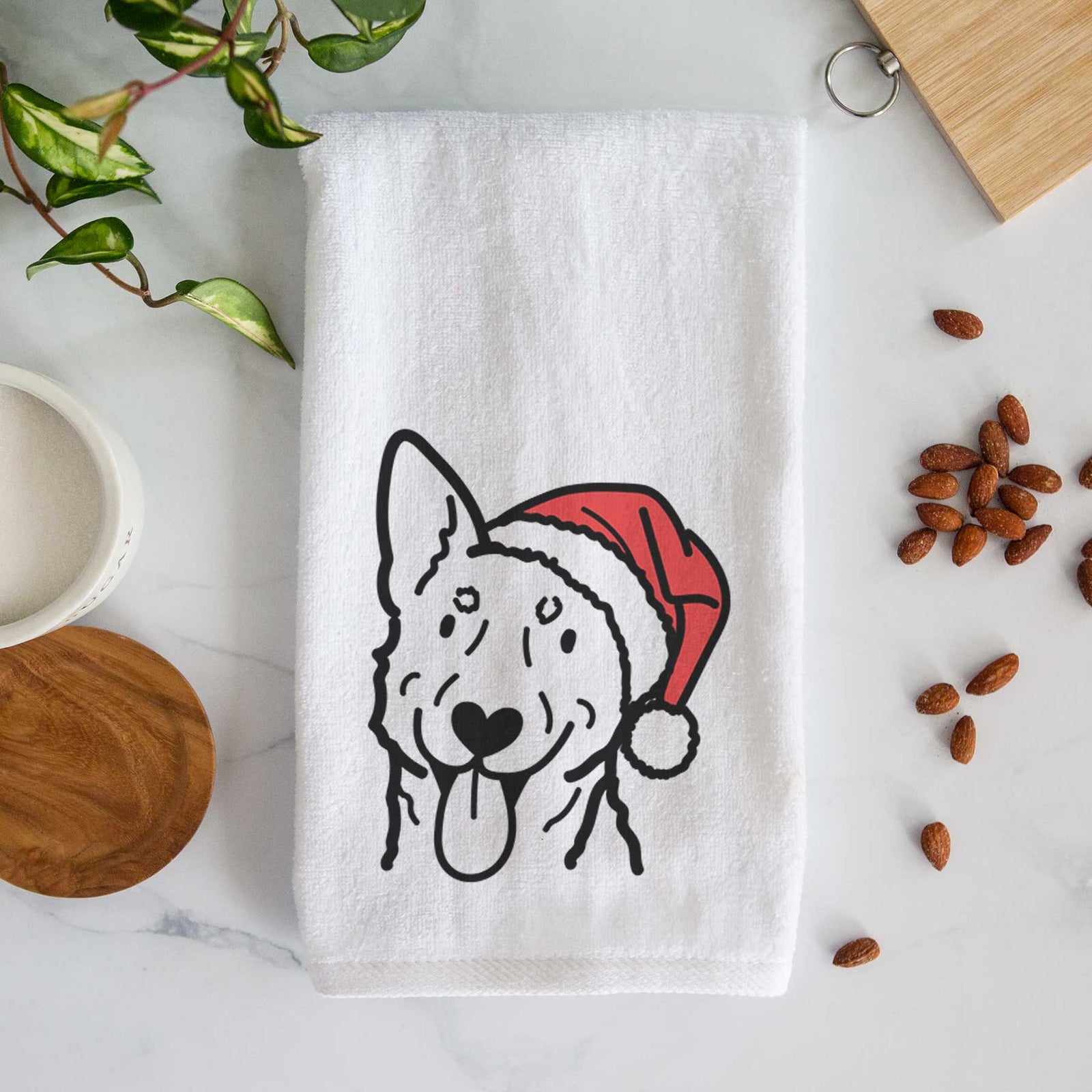 Minimalist line drawing of an Australian Cattle Dog wearing a Santa hat on a decorative hand towel