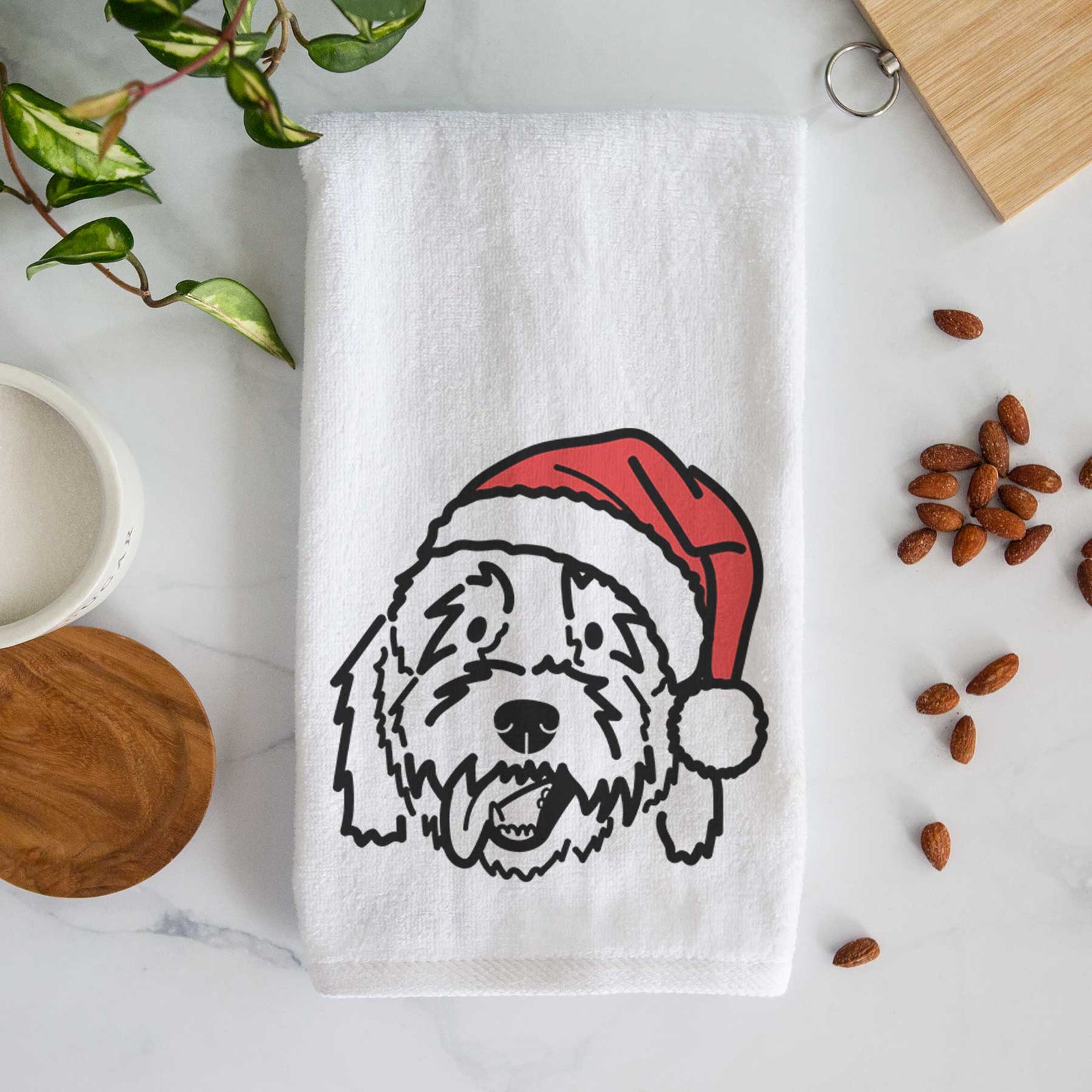 Minimalist line drawing of Barry the Goldendoodle wearing a Santa hat on a decorative hand towel