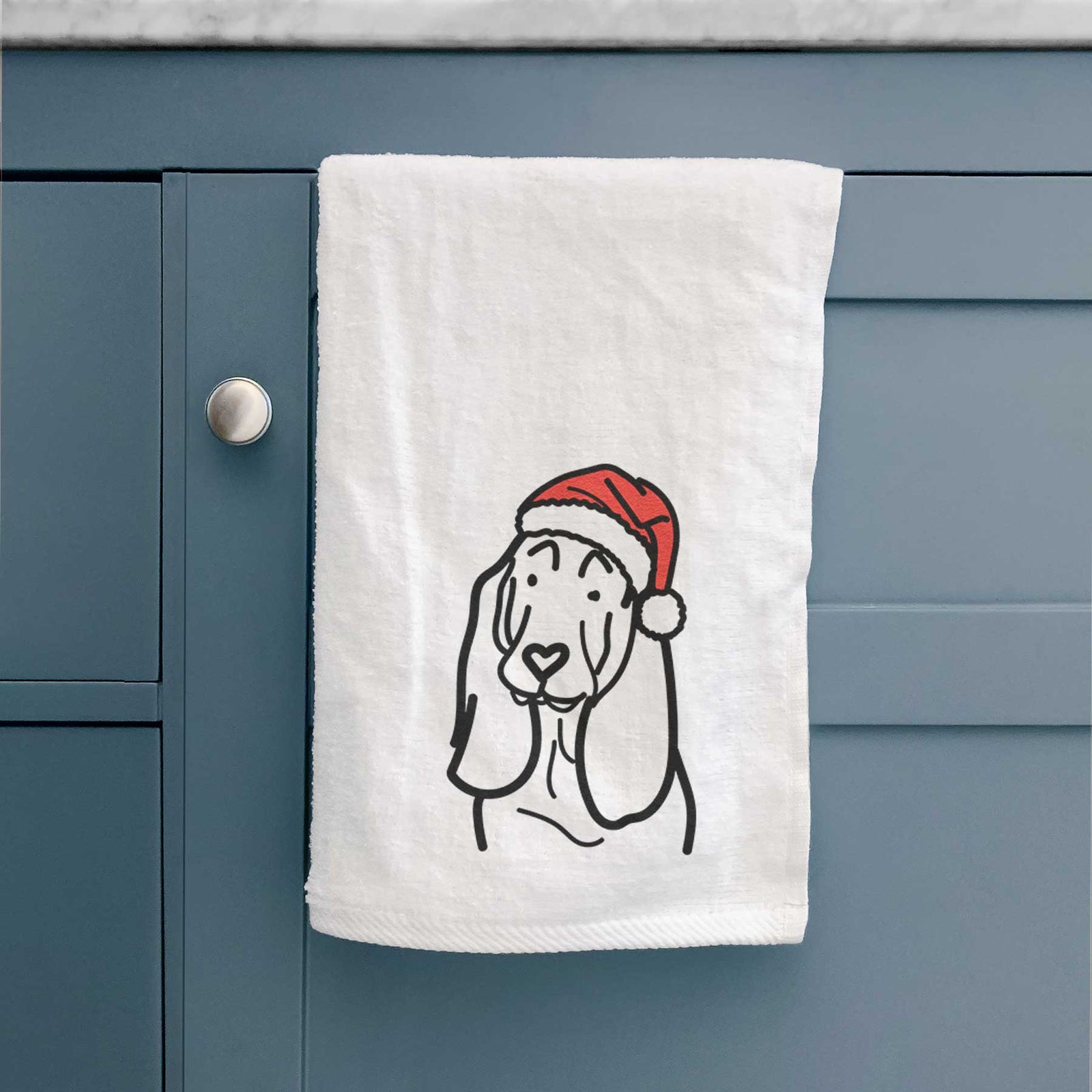 Minimalist line drawing of a Basset Hound wearing a Santa hat on a decorative hand towel