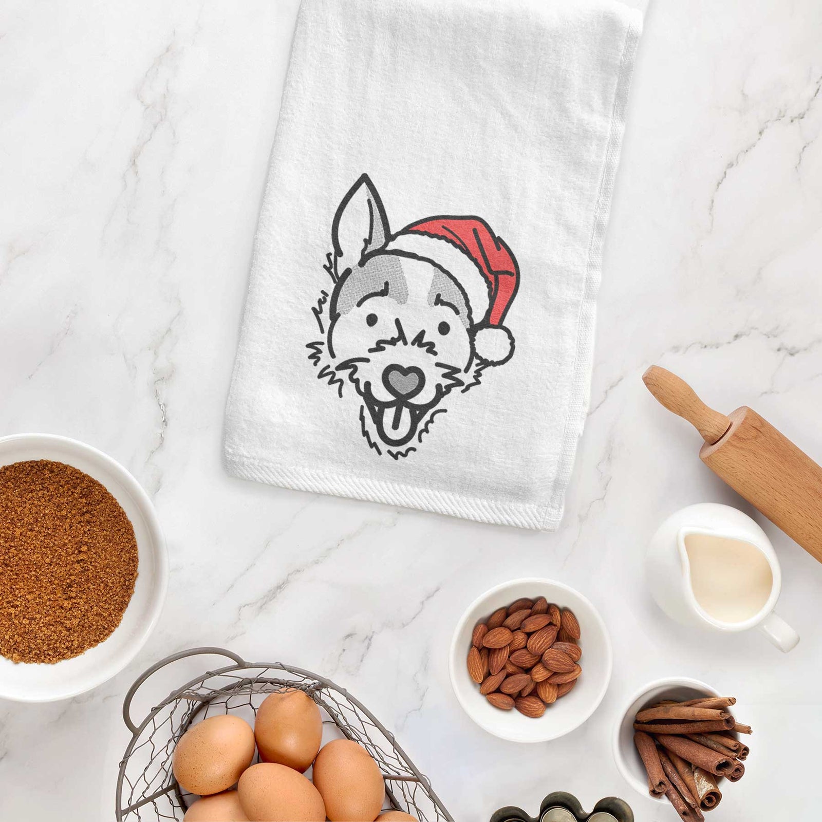 Minimalist line drawing of Baxter the Jack Russell Terrier wearing a Santa hat on a decorative hand towel