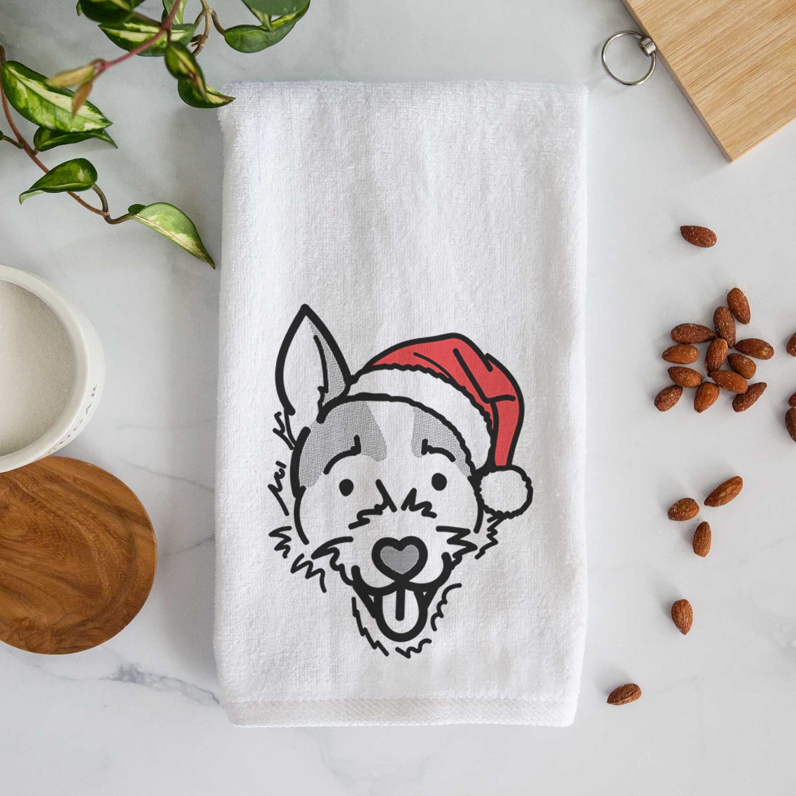 Minimalist line drawing of Baxter the Jack Russell Terrier wearing a Santa hat on a decorative hand towel