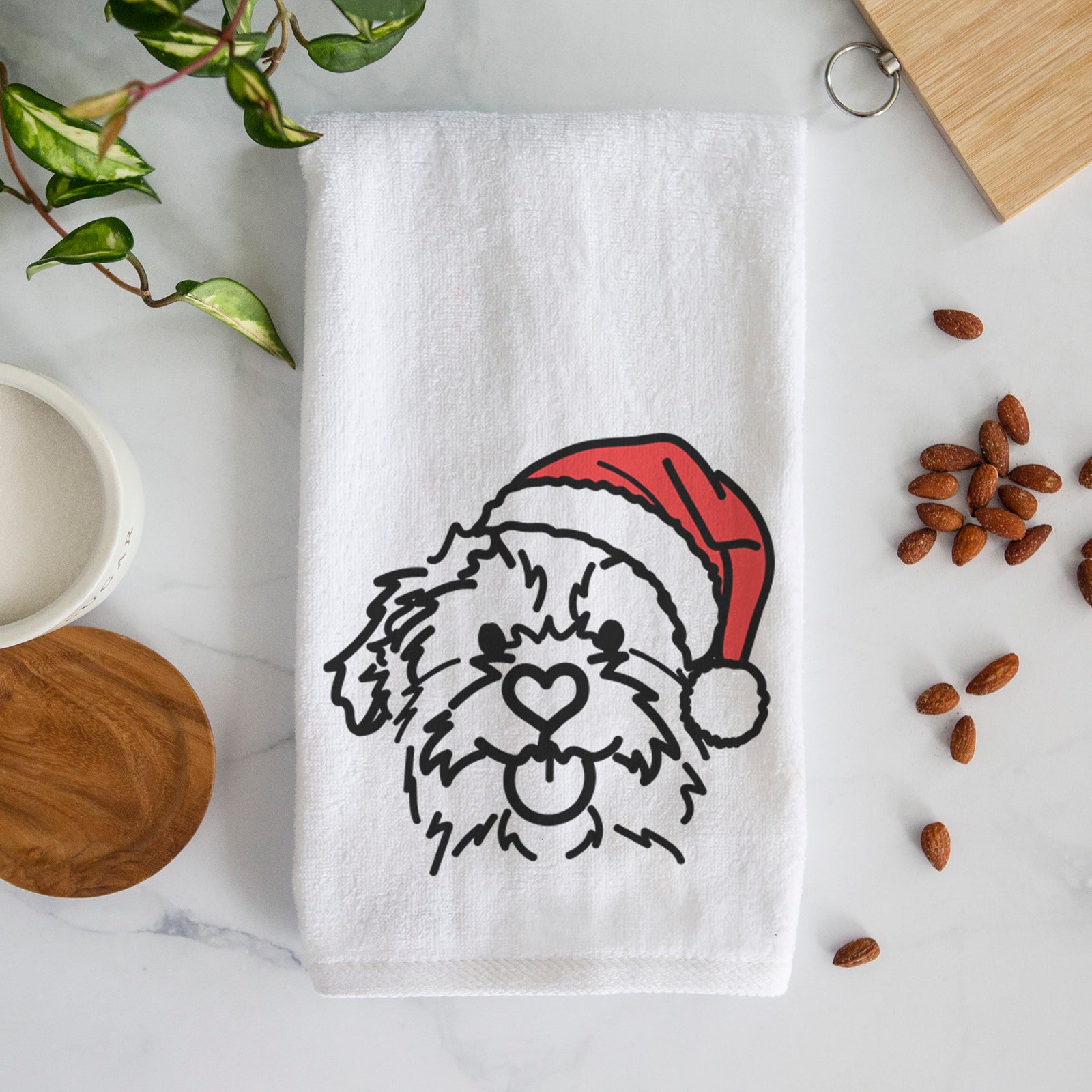Minimalist line drawing of Bea the Mixed Breed wearing a Santa hat on a decorative hand towel