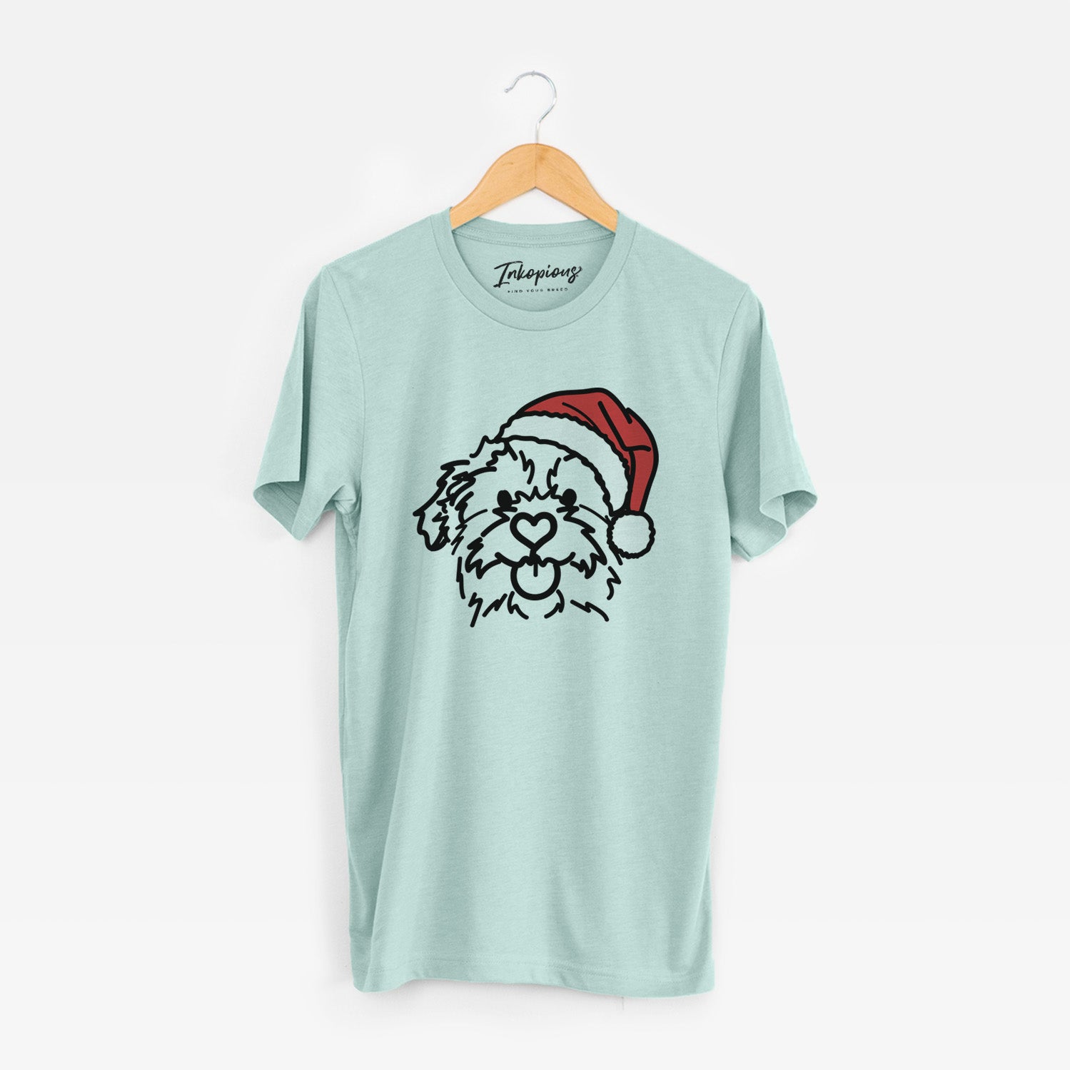 Minimalist line drawing of Bea the Mixed Breed wearing a Santa hat on a Heather Sage Unisex crewneck