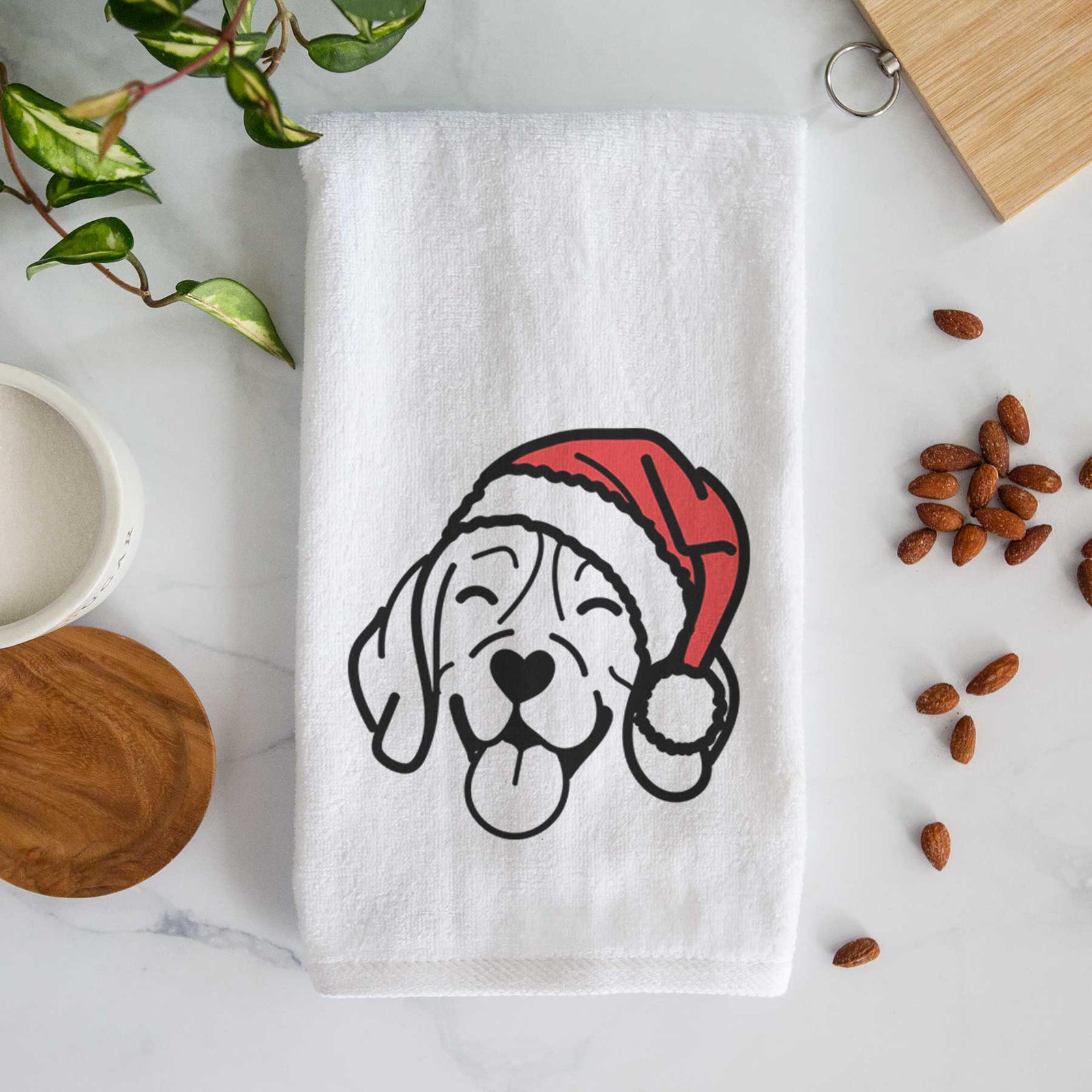 Minimalist line drawing of a Beagle wearing a Santa hat on a decorative hand towel