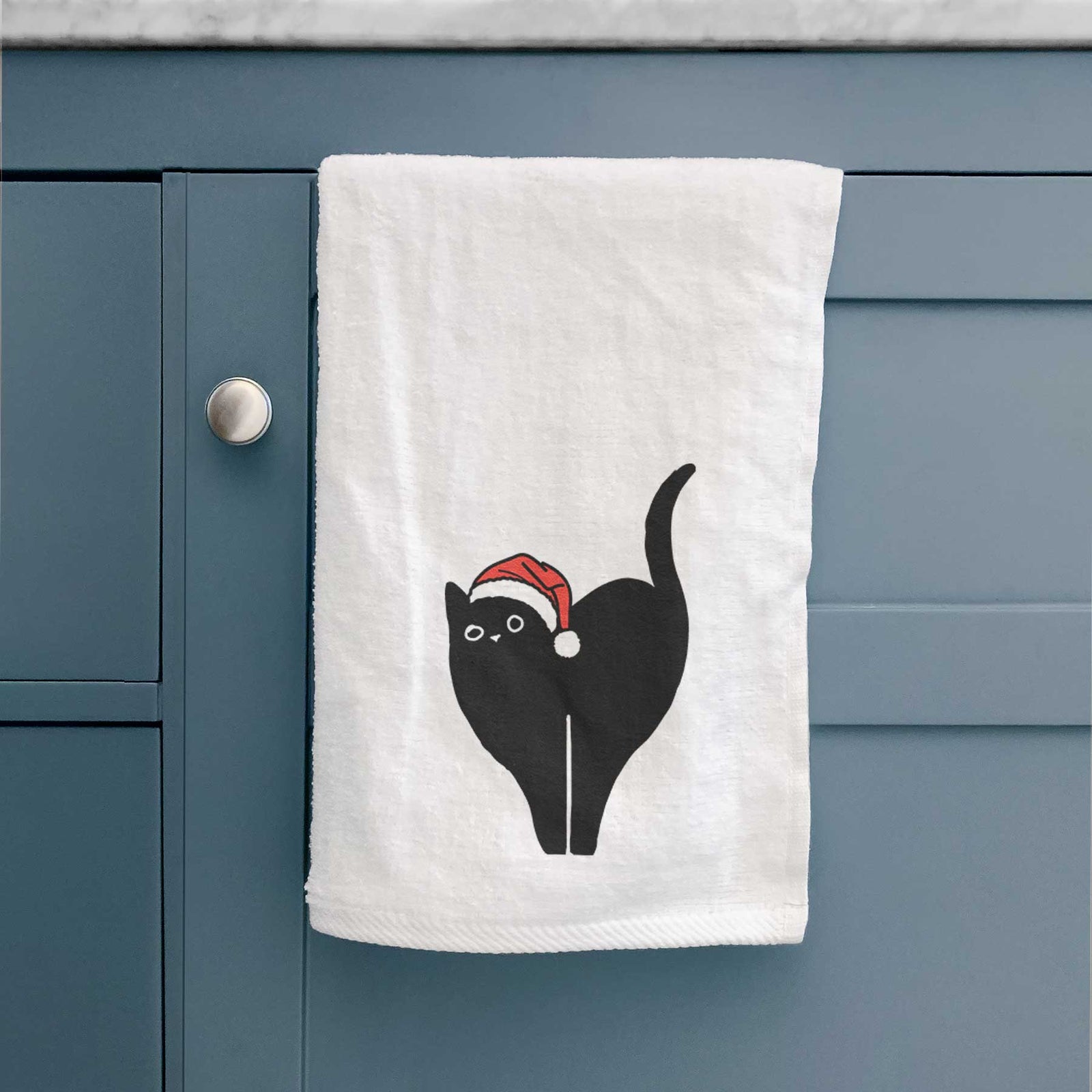 Minimalist line drawing of Bella the Black Cat wearing a Santa hat on a decorative hand towel