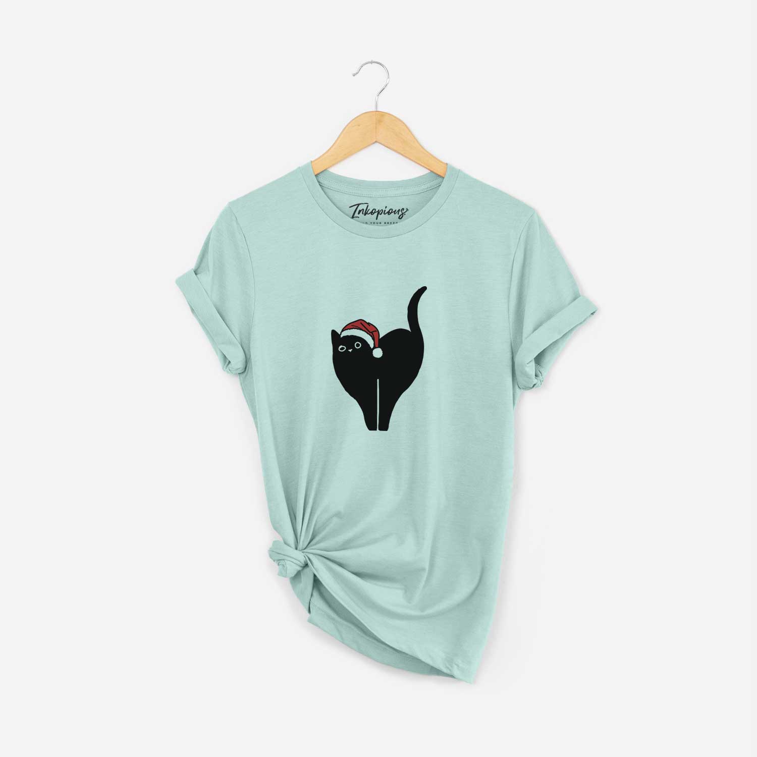Minimalist line drawing of Bella the Black Cat wearing a Santa hat on a Heather Sage Unisex crewneck