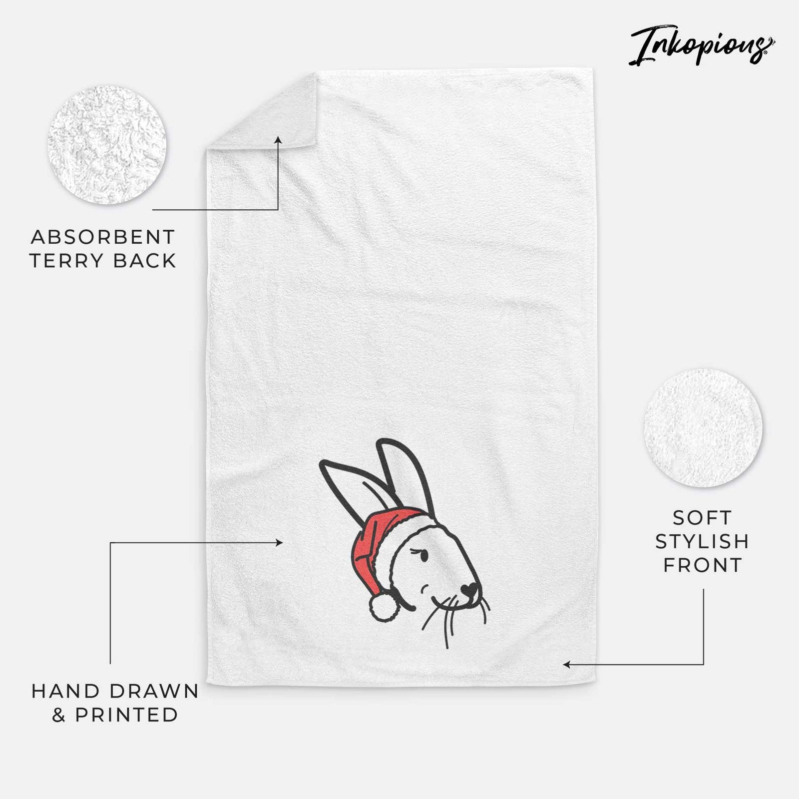 Minimalist line drawing of Betsy the Rex Rabbit wearing a Santa hat on a decorative hand towel