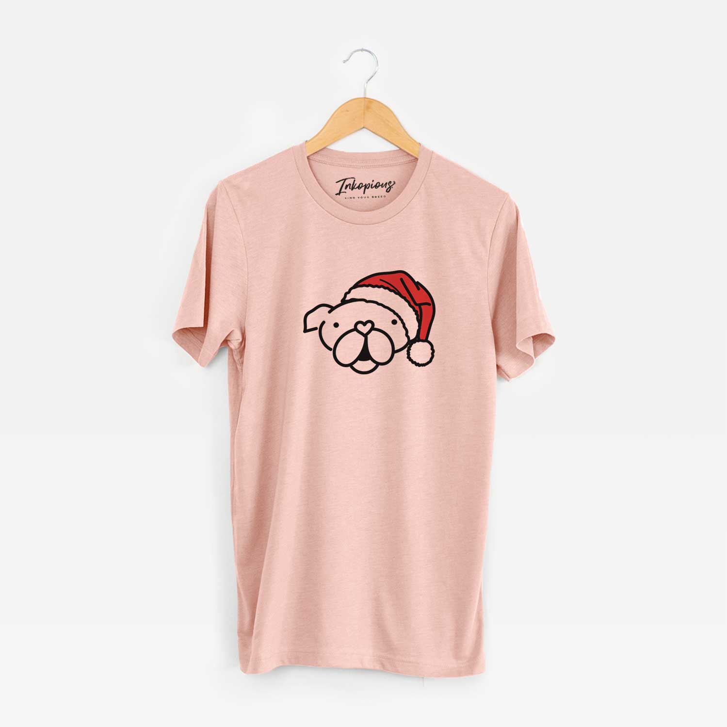 Minimalist line drawing of an English Bulldog wearing a Santa hat on a Peach Unisex crewneck