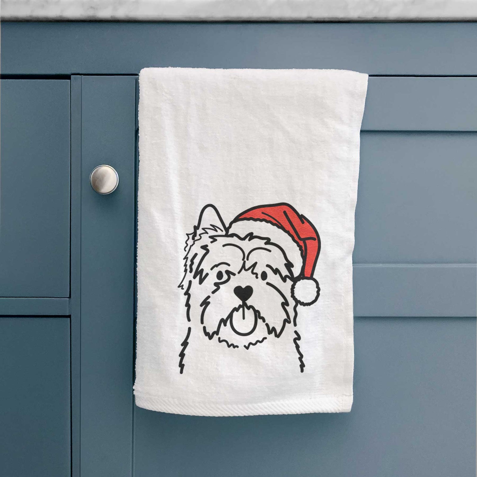 Minimalist line drawing of a Cairn Terrier wearing a Santa hat on a decorative hand towel