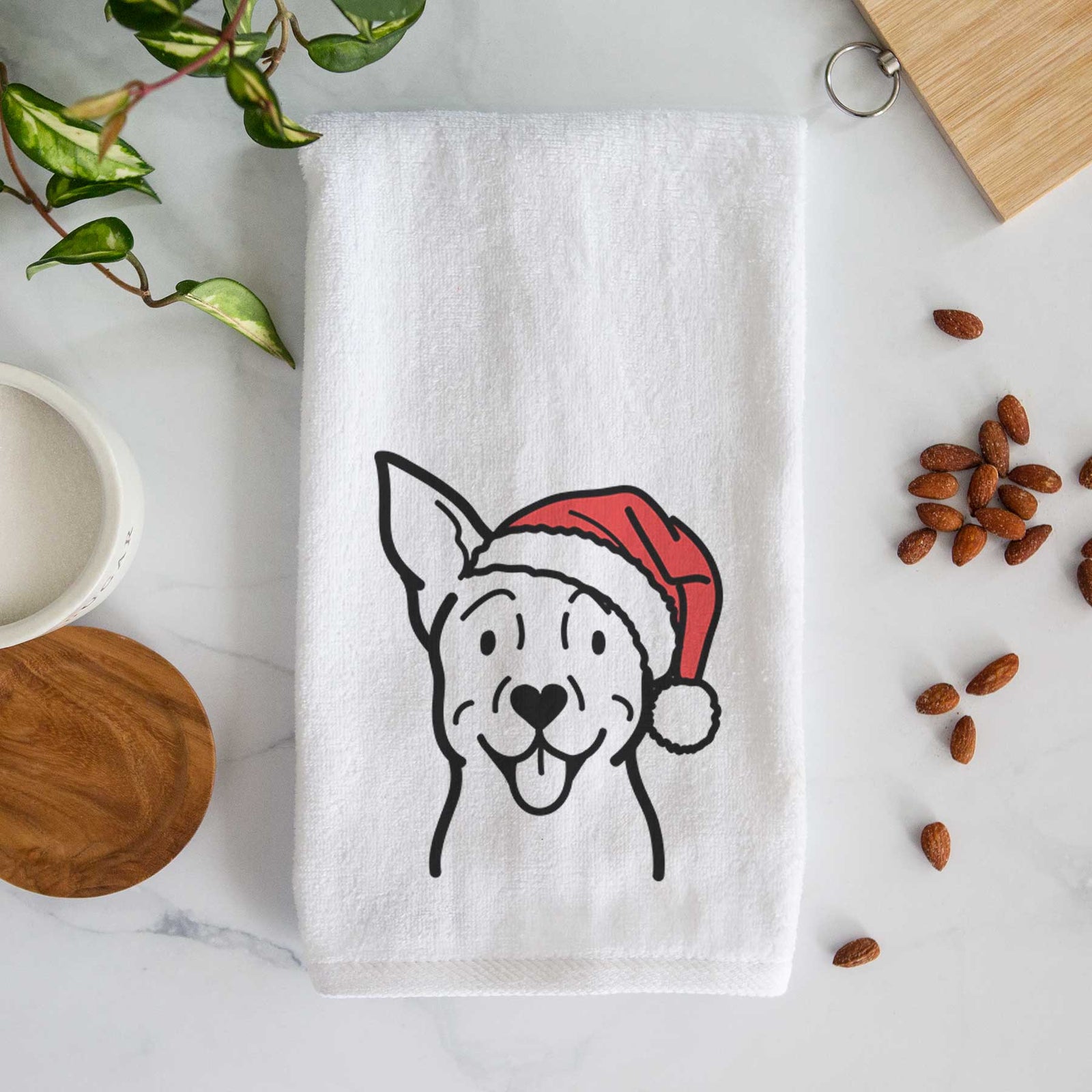 Minimalist line drawing of a Carolina Dog wearing a Santa hat on a decorative hand towel