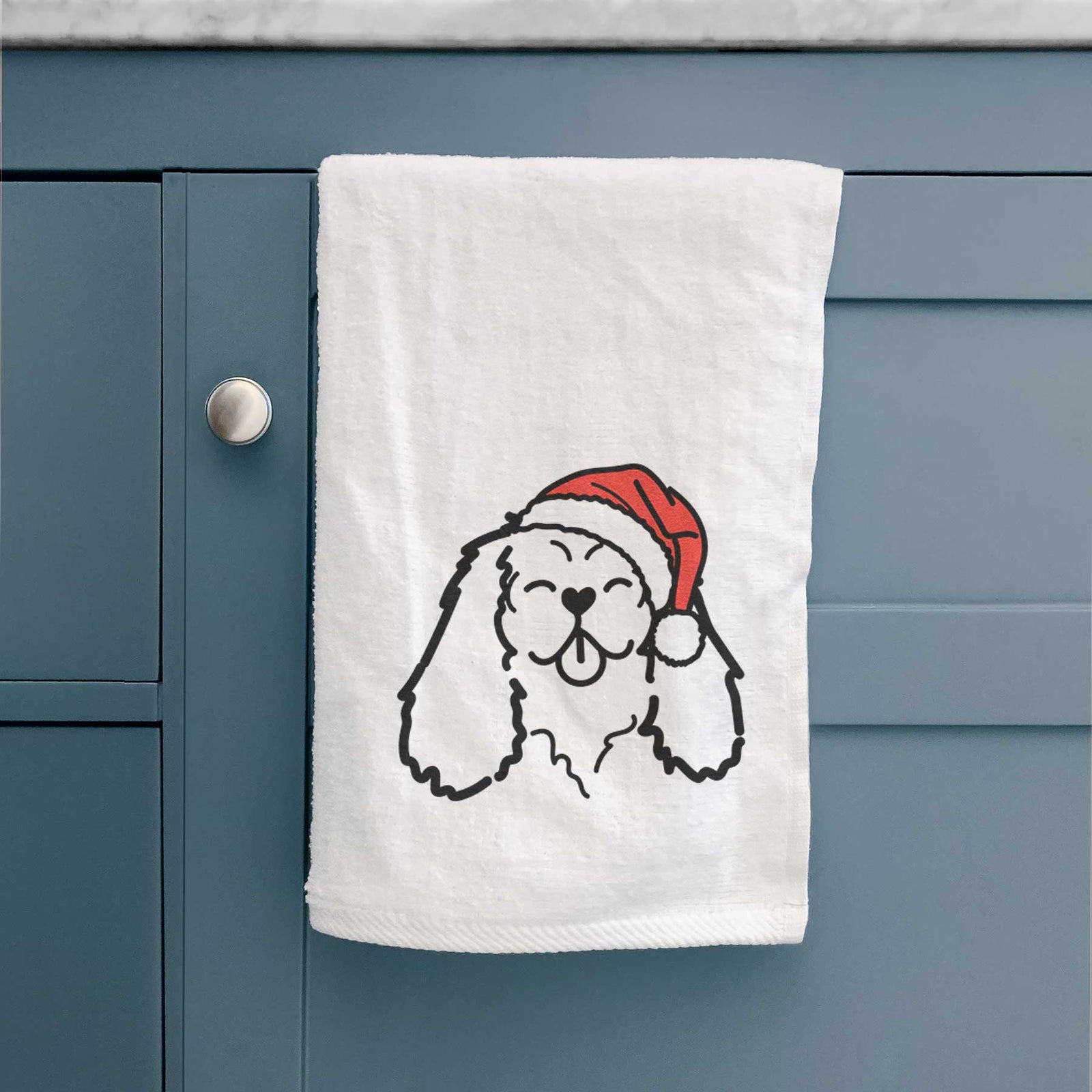 Minimalist line drawing of a Cavalier King Charles Spaniel wearing a Santa hat on a decorative hand towel