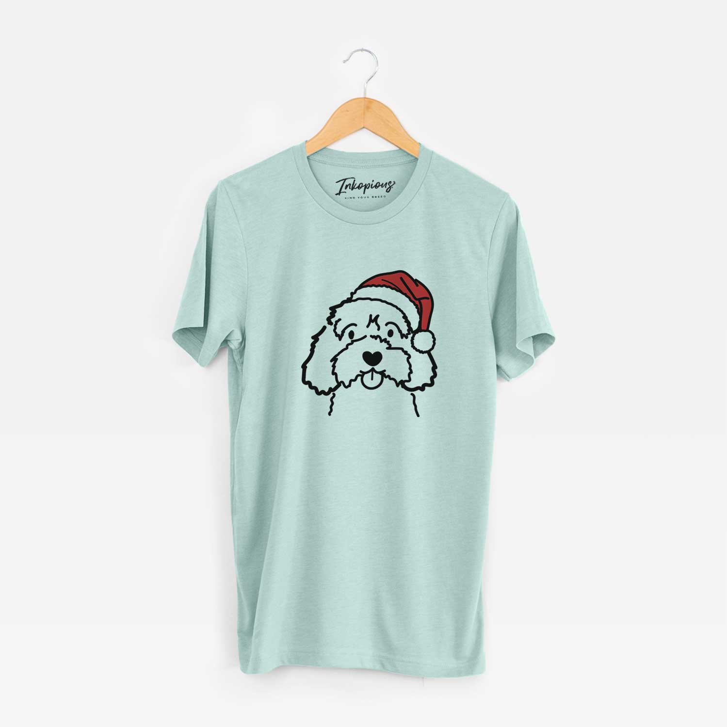 Minimalist line drawing of a Cavapoo wearing a Santa hat on a Heather Sage Unisex crewneck