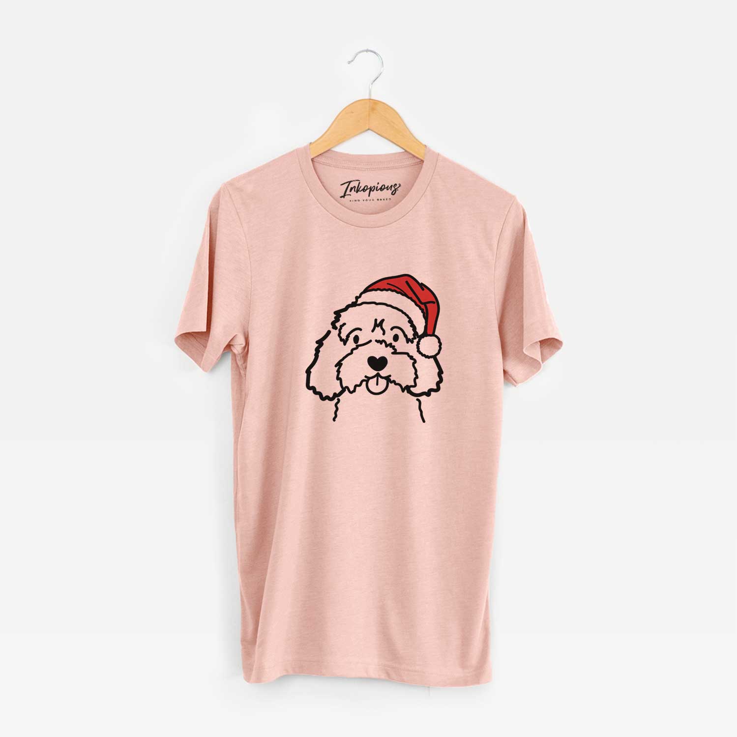 Minimalist line drawing of a Cavapoo wearing a Santa hat on a Peach Unisex crewneck