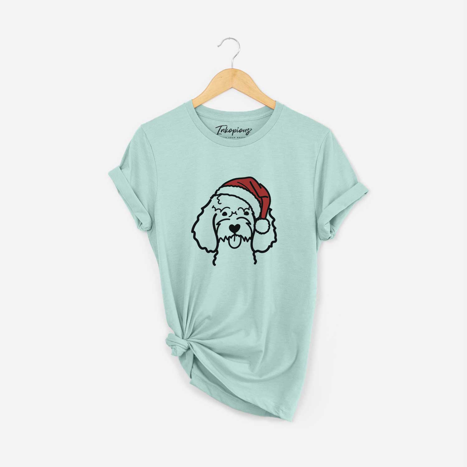 Minimalist line drawing of a Cockapoo wearing a Santa hat on a Heather Sage Unisex crewneck