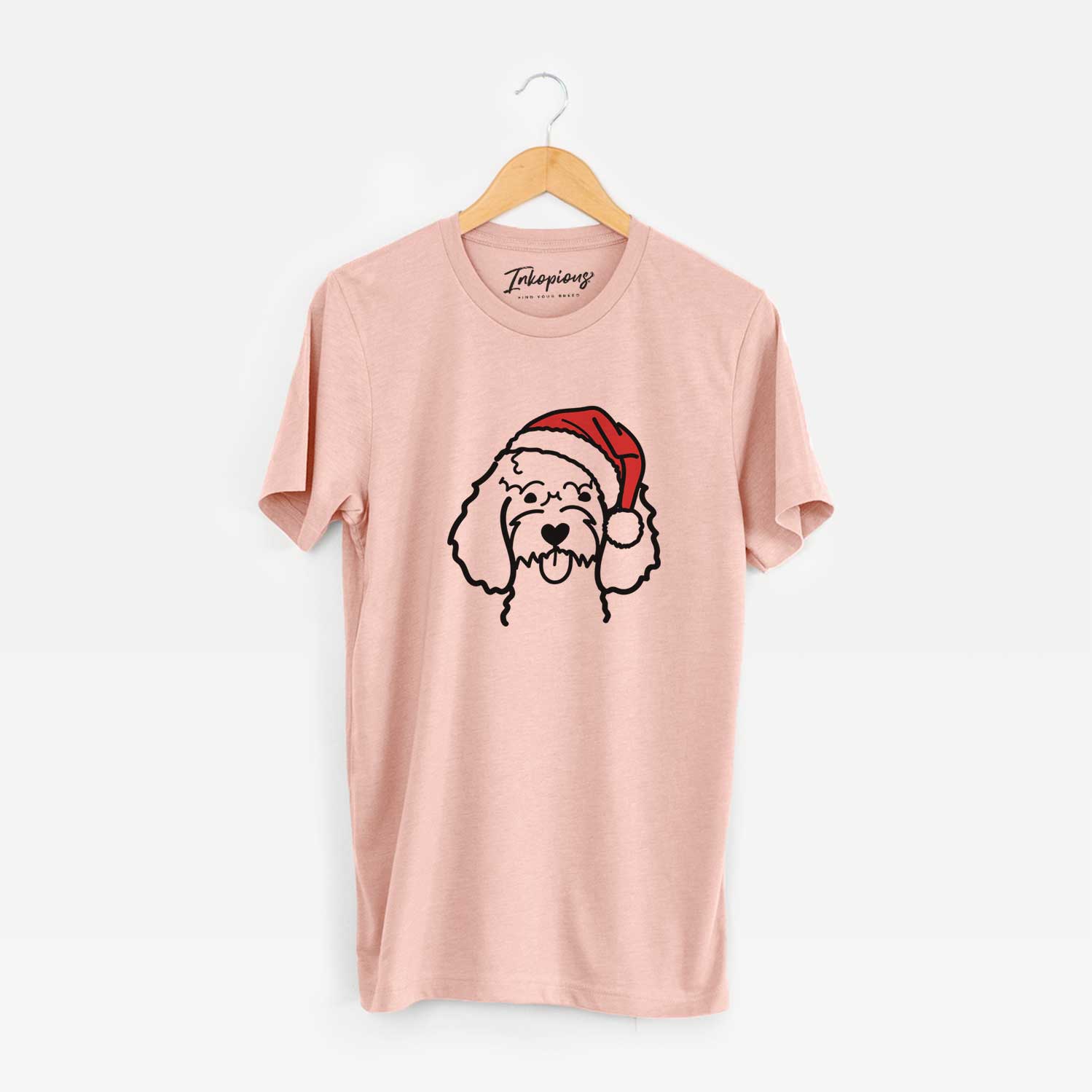 Minimalist line drawing of a Cockapoo wearing a Santa hat on a Peach Unisex crewneck