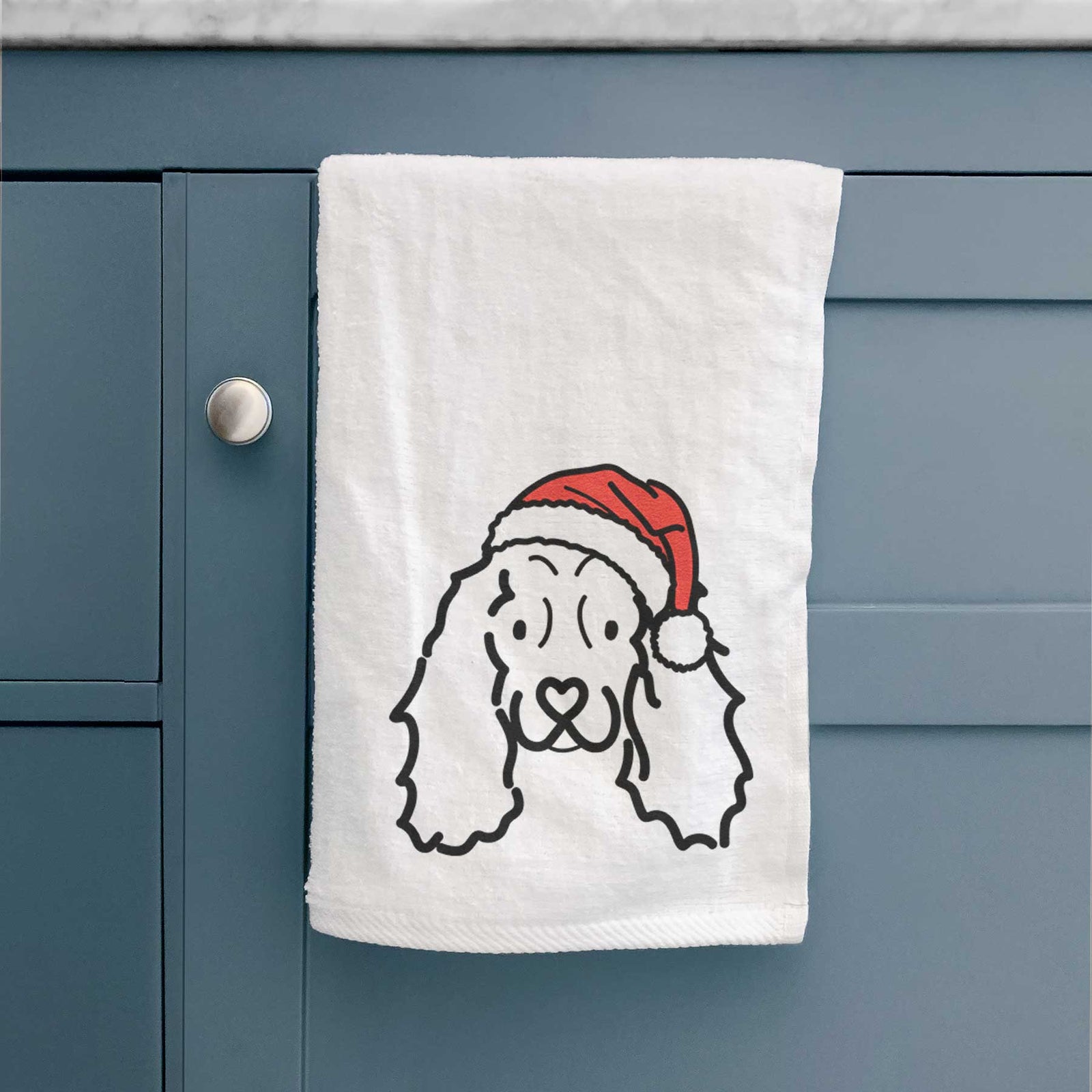 Minimalist line drawing of an American Cocker Spaniel wearing a Santa hat on a decorative hand towel