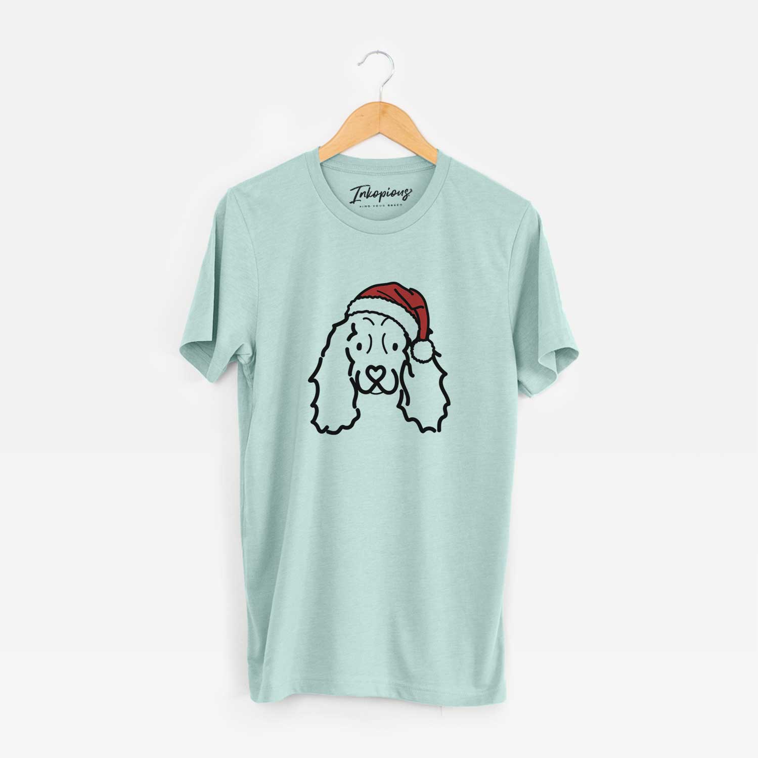 Minimalist line drawing of an American Cocker Spaniel wearing a Santa hat on a Heather Sage Unisex crewneck