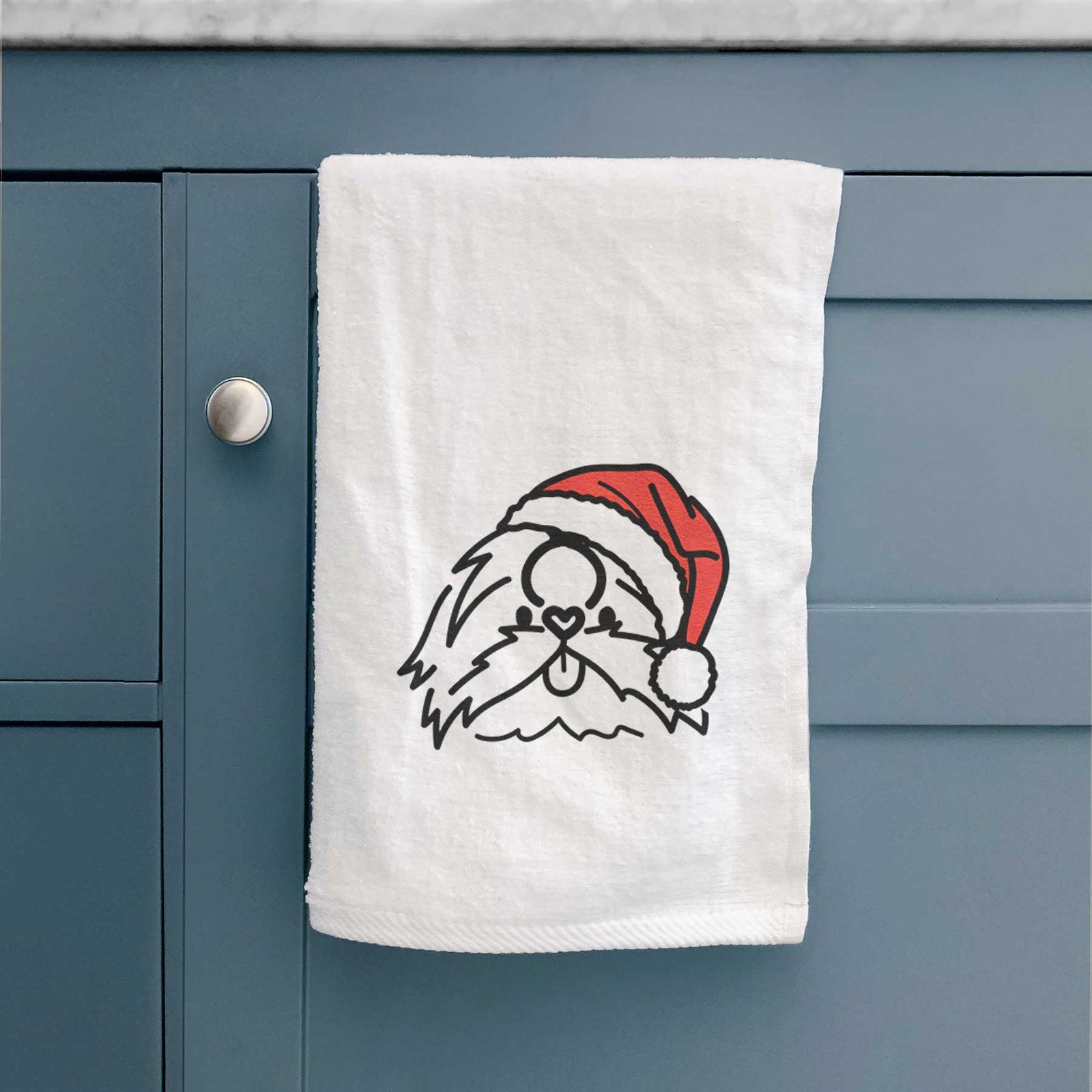 Minimalist line drawing of CoCo the Shih Tzu wearing a Santa hat on a decorative hand towel