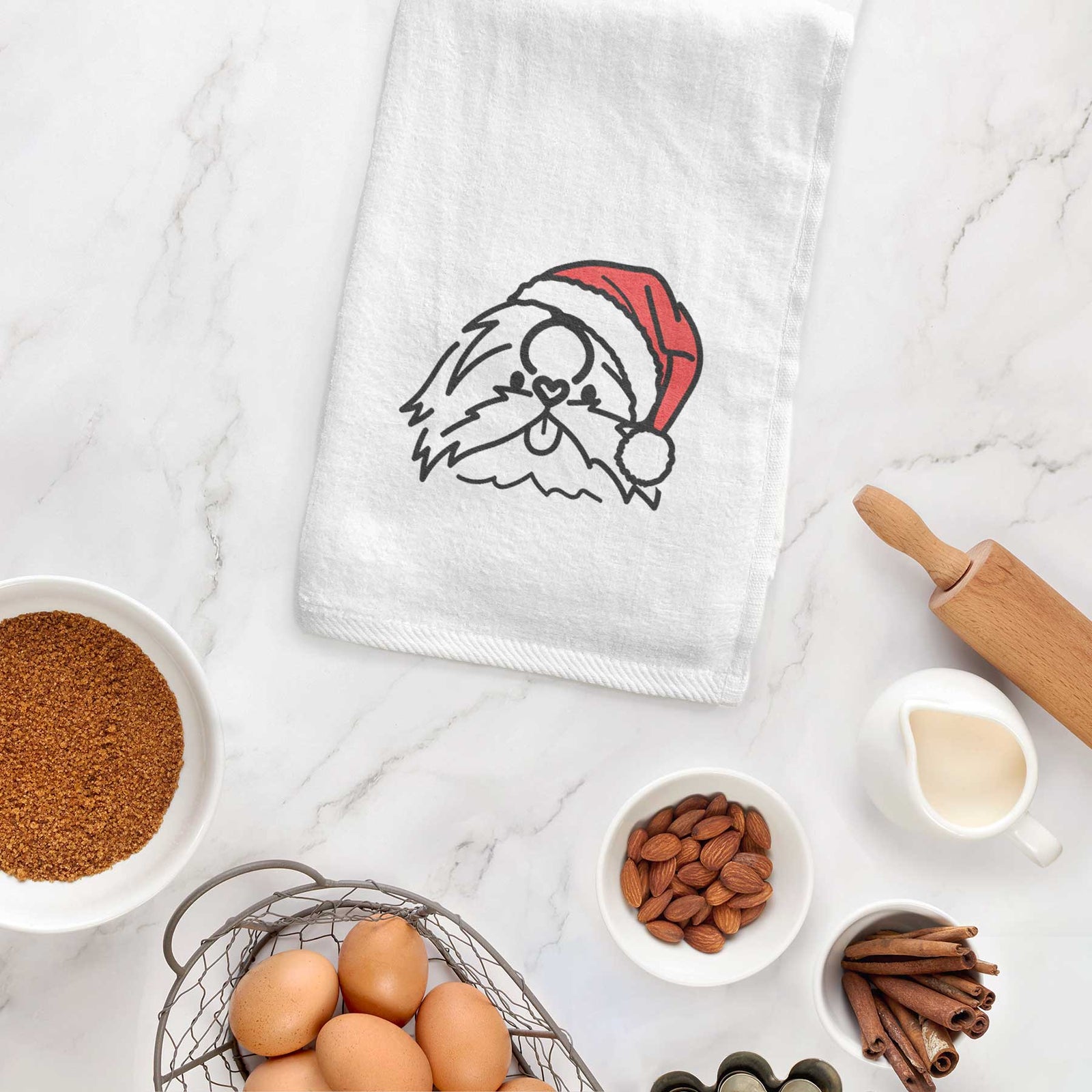 Minimalist line drawing of CoCo the Shih Tzu wearing a Santa hat on a decorative hand towel