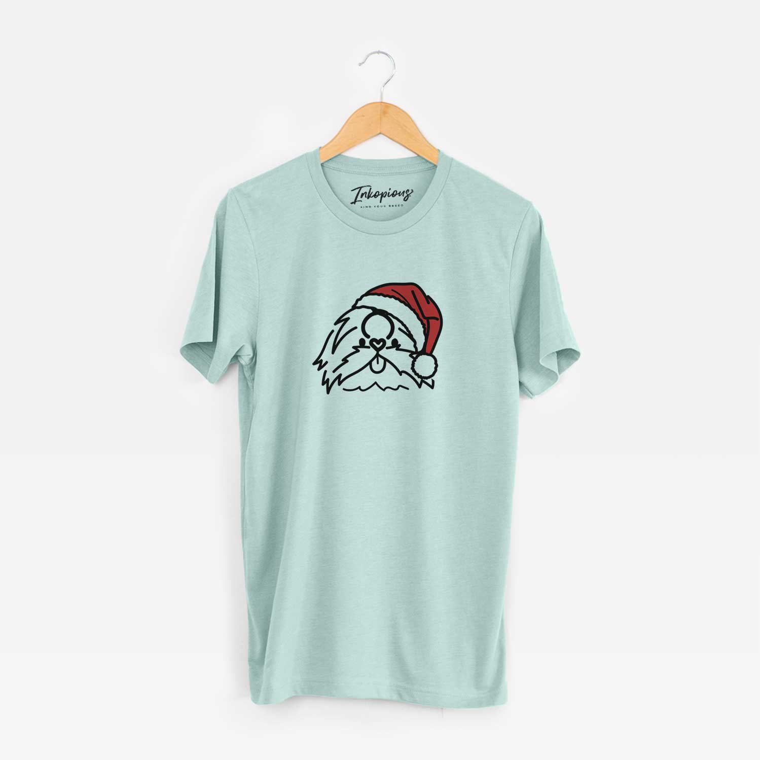 Minimalist line drawing of CoCo the Shih Tzu wearing a Santa hat on a Heather Sage Unisex crewneck