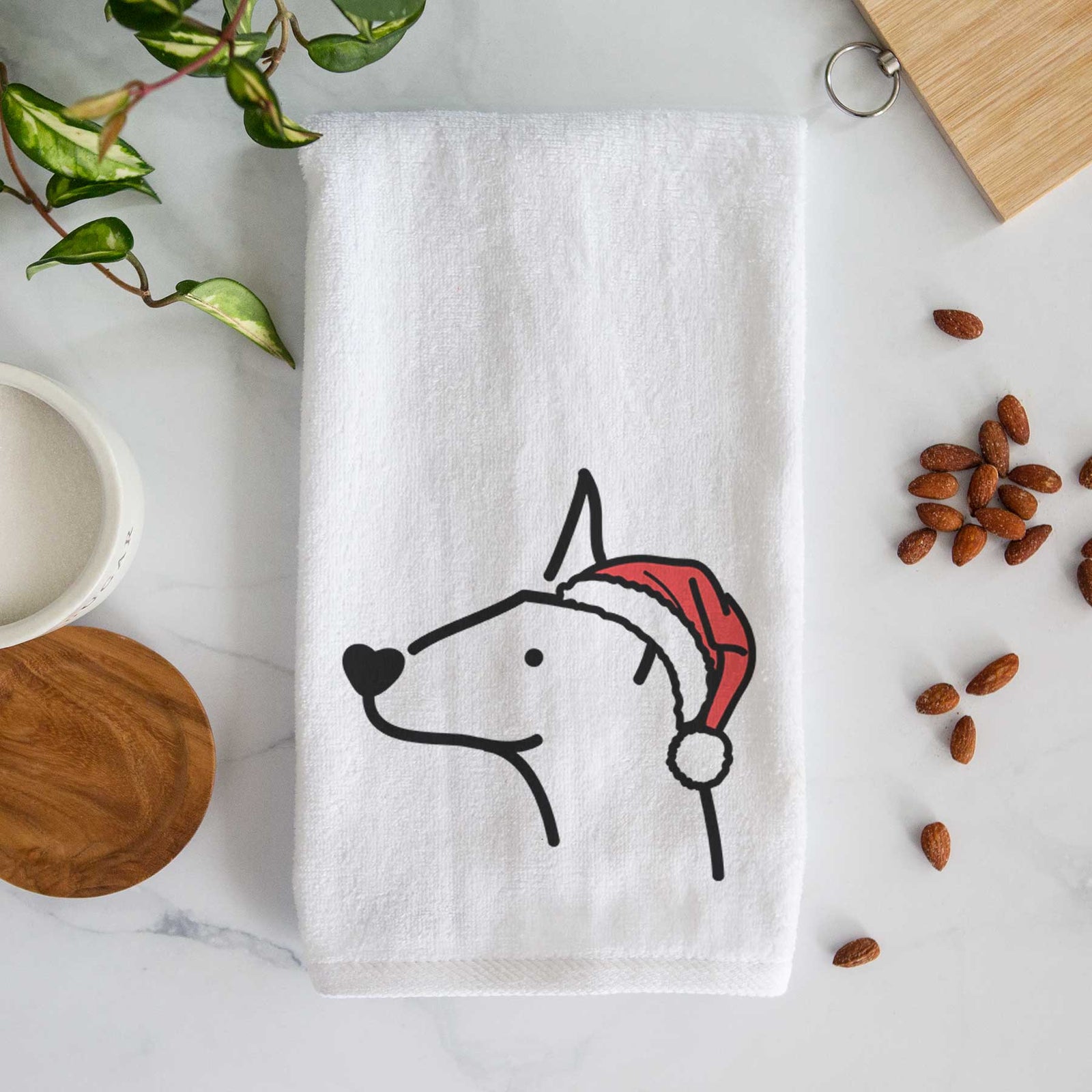 Minimalist line drawing of a Doberman Pinscher wearing a Santa hat on a decorative hand towel