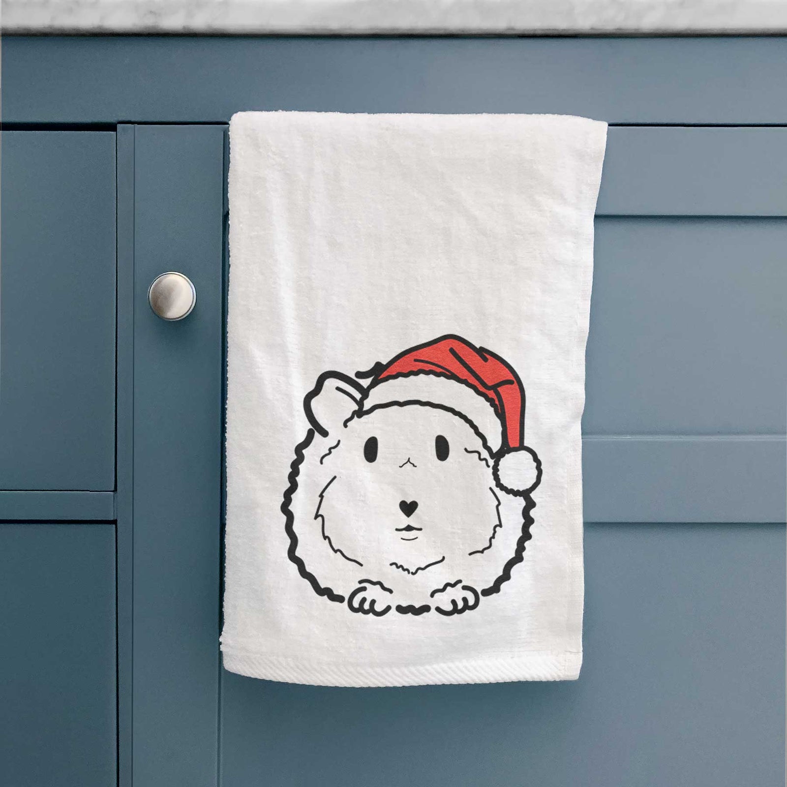 Minimalist line drawing of Duke the Guinea Pig wearing a Santa hat on a decorative hand towel