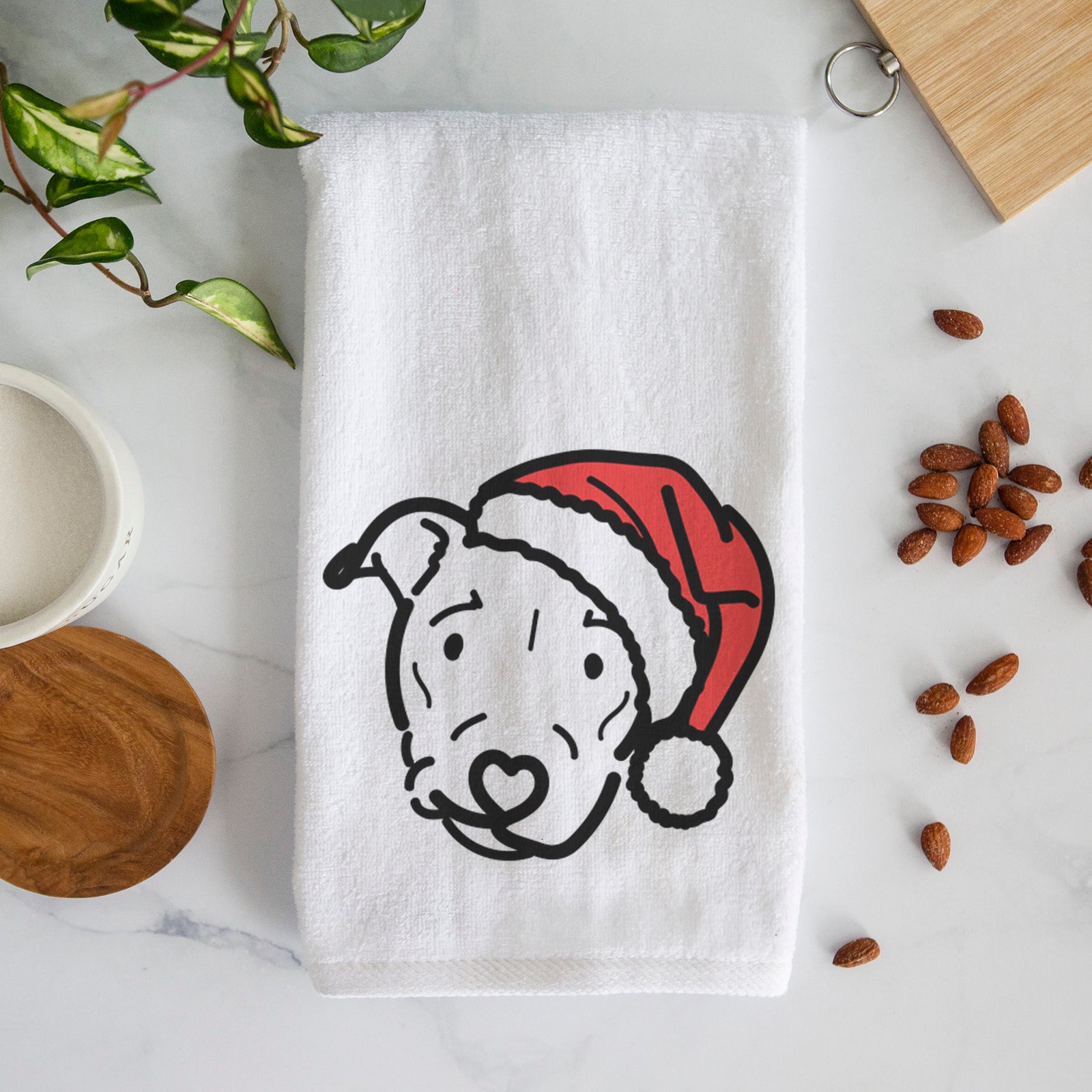 Minimalist line drawing of Ernie the Pitbull Mix wearing a Santa hat on a decorative hand towel