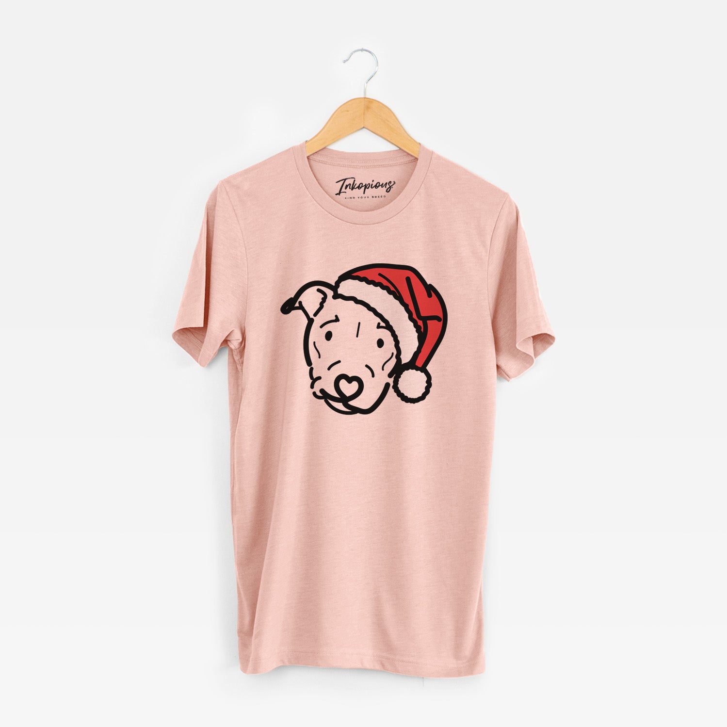 Minimalist line drawing of Ernie the Pitbull Mix wearing a Santa hat on a Peach Unisex crewneck