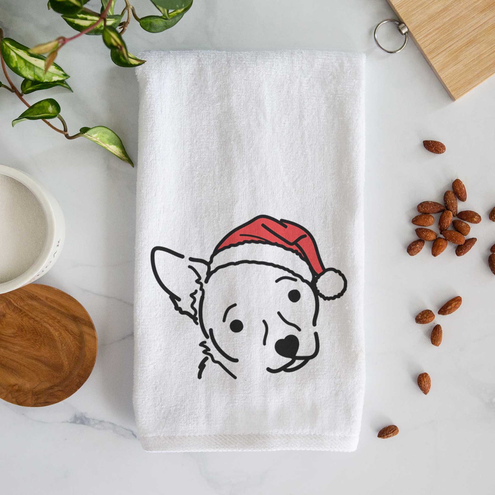 Minimalist line drawing of GiGi the Chihuahua Mix wearing a Santa hat on a decorative hand towel