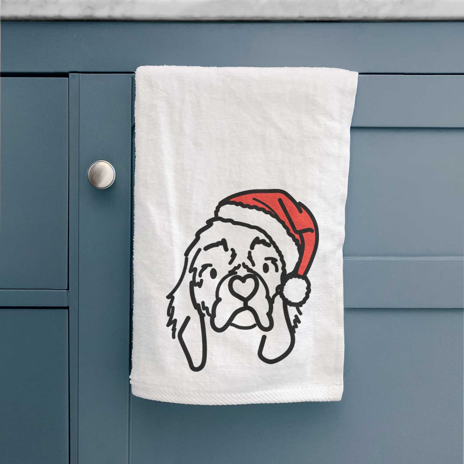 Minimalist line drawing of GiGi the Cocker Spaniel wearing a Santa hat on a decorative hand towel