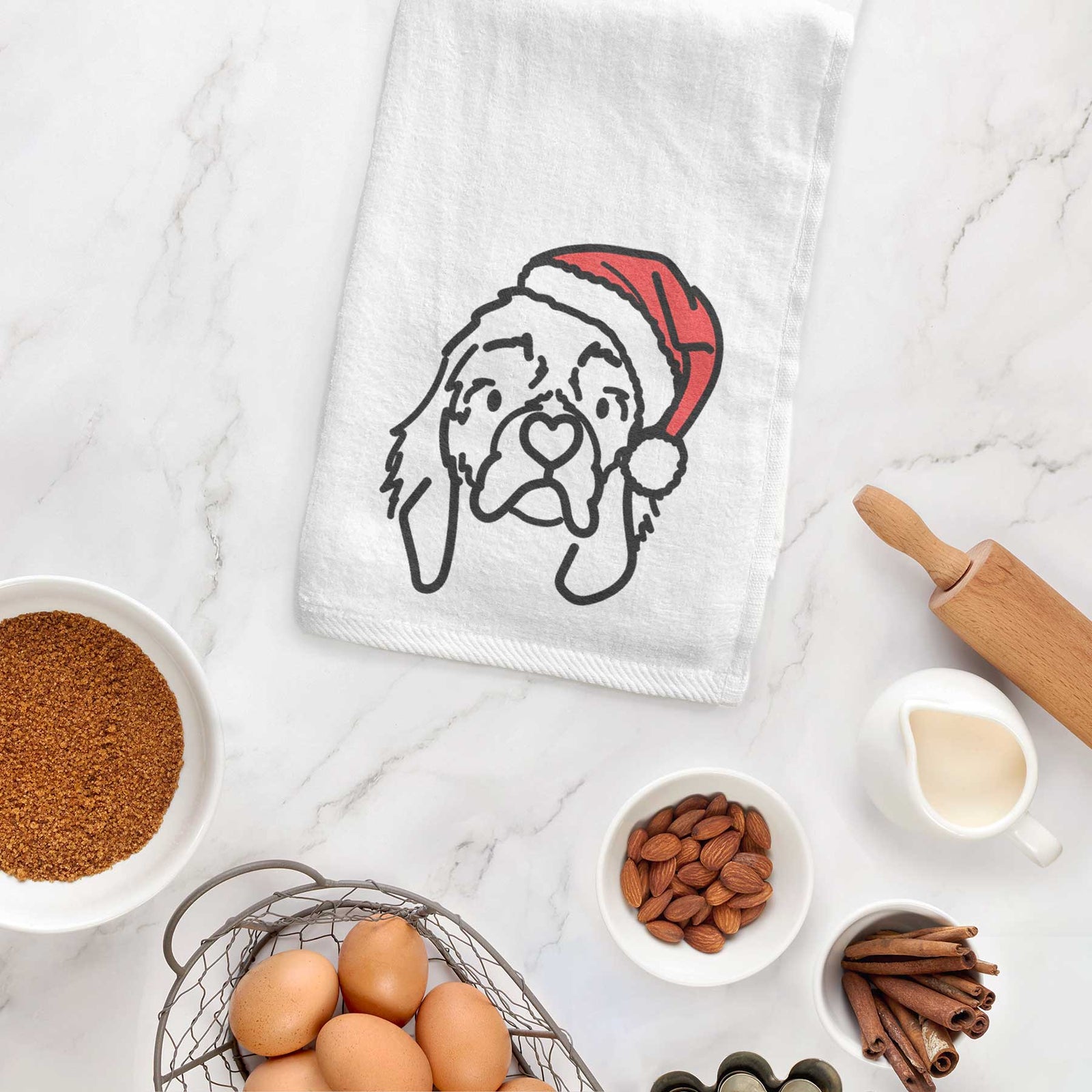 Minimalist line drawing of GiGi the Cocker Spaniel wearing a Santa hat on a decorative hand towel
