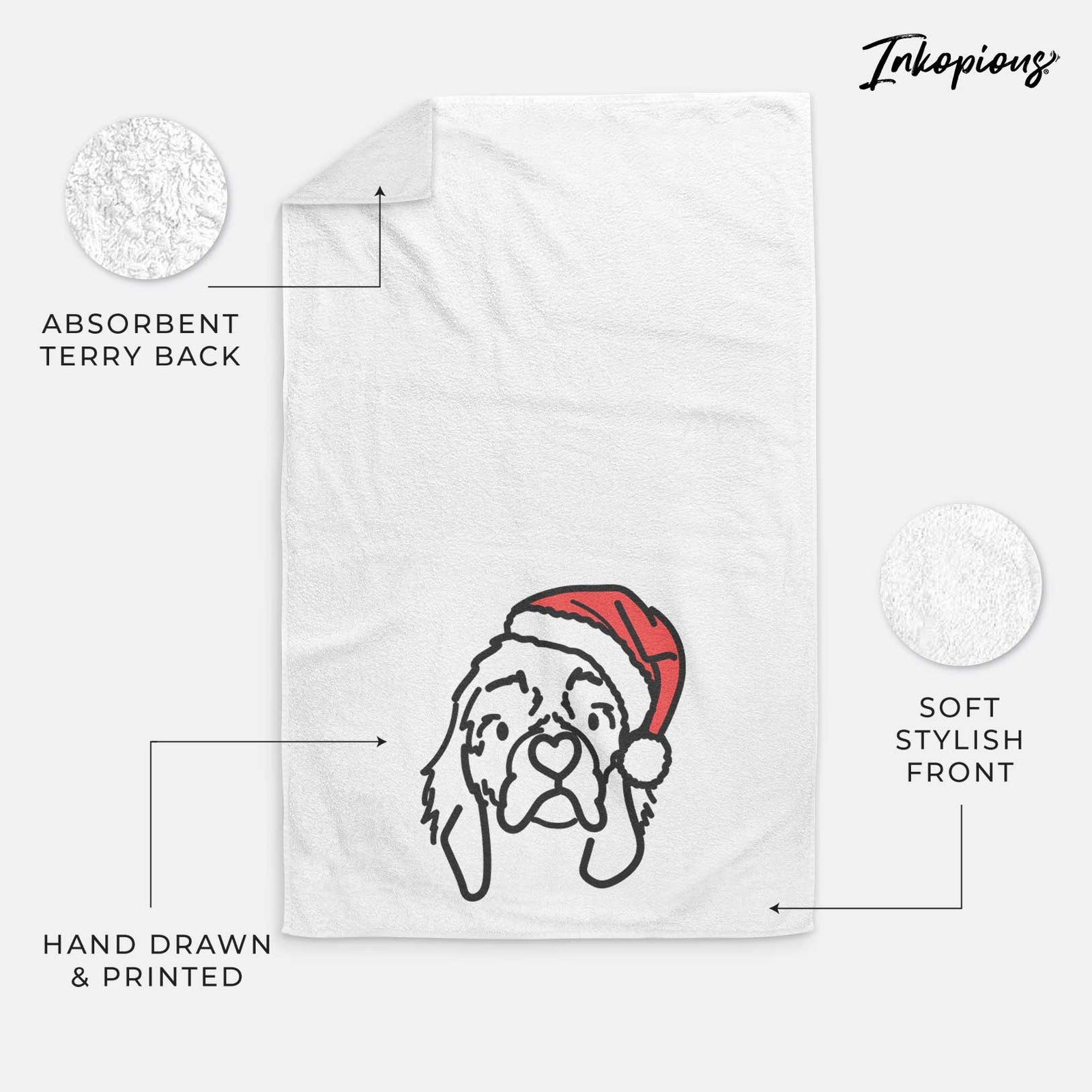 Minimalist line drawing of GiGi the Cocker Spaniel wearing a Santa hat on a decorative hand towel