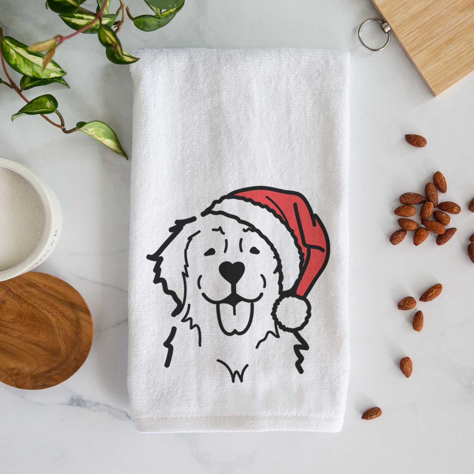 Minimalist line drawing of a Golden Retriever wearing a Santa hat on a decorative hand towel