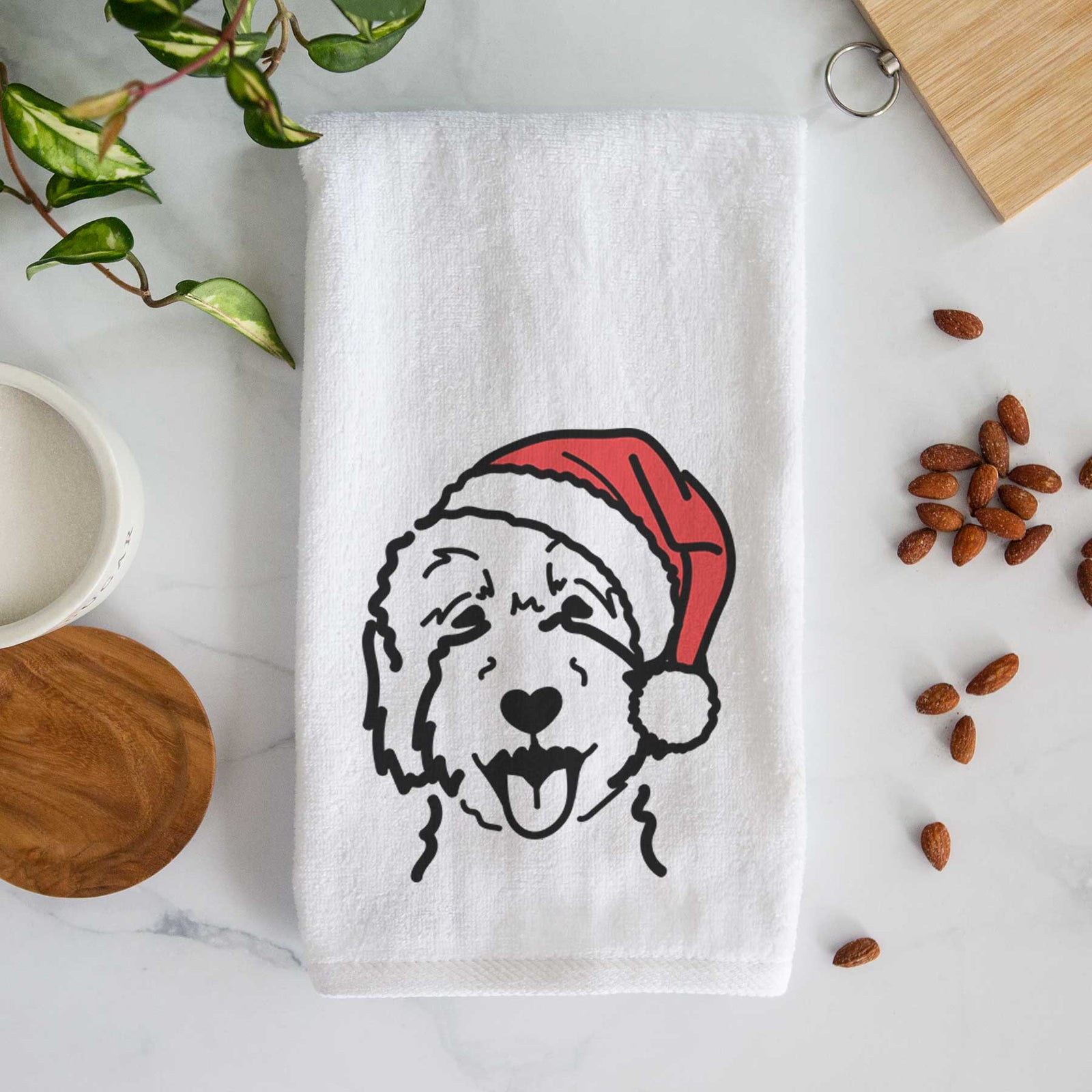 Minimalist line drawing of a Goldendoodle 2 wearing a Santa hat on a decorative hand towel