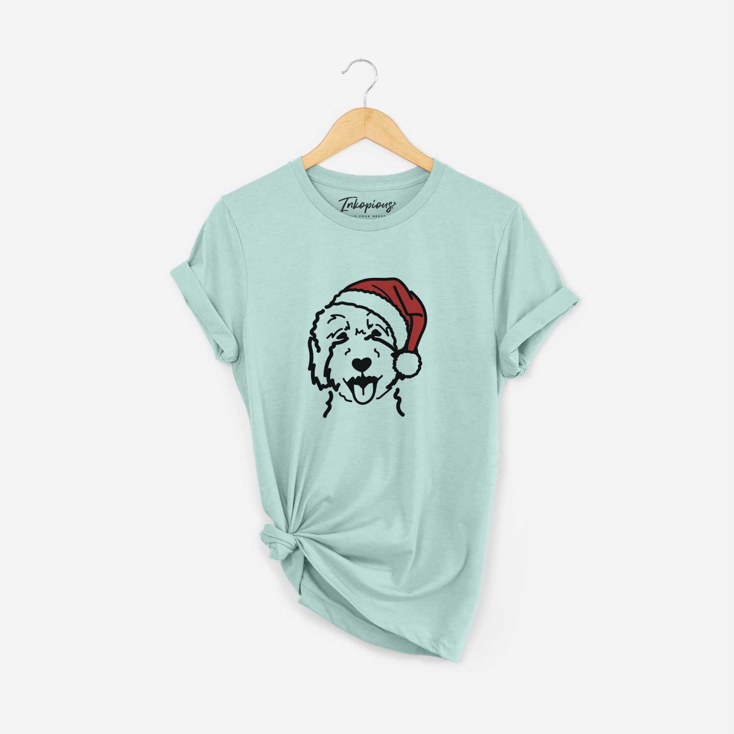 Minimalist line drawing of a Goldendoodle 2 wearing a Santa hat on a Heather Sage Unisex crewneck
