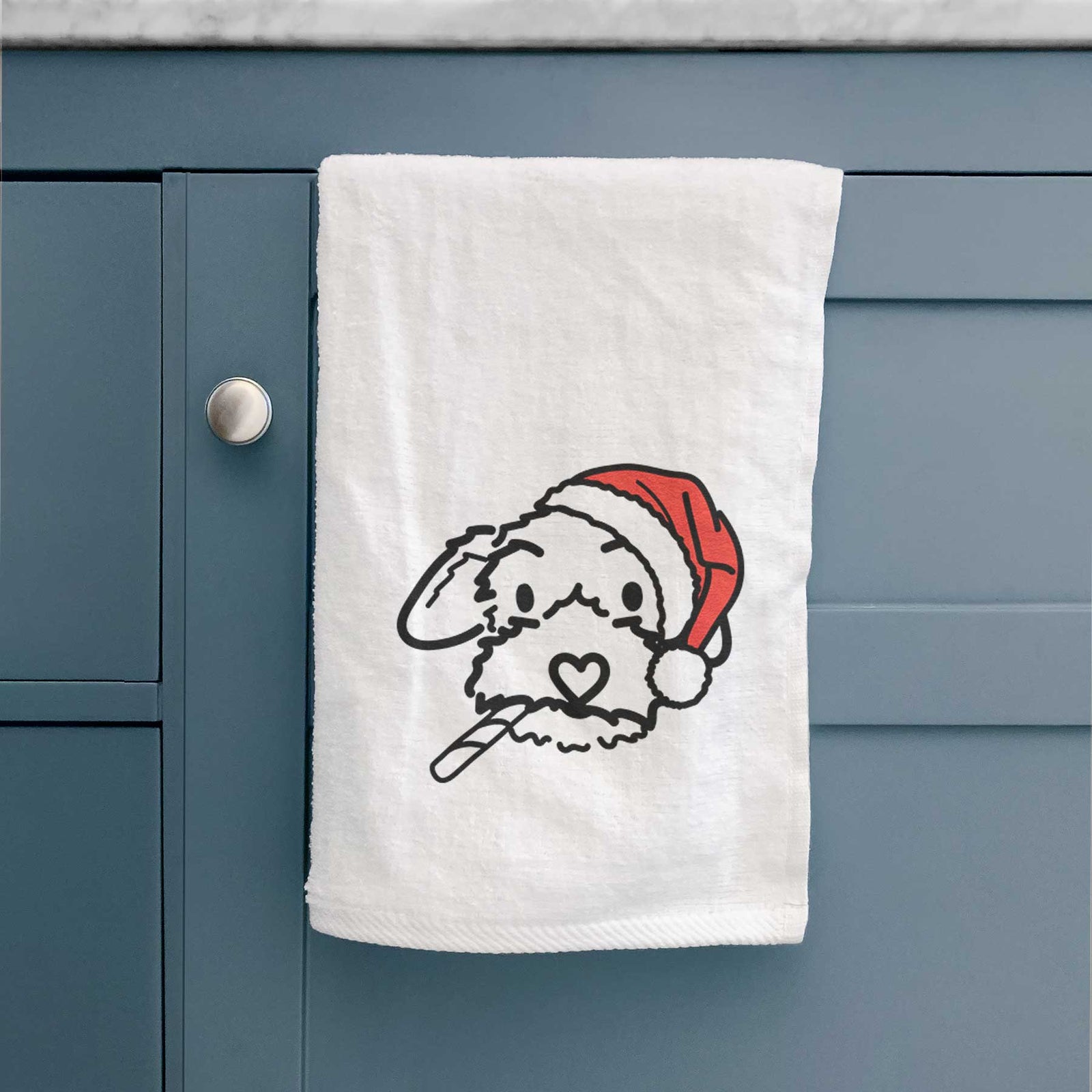 Minimalist line drawing of Gomer the Poodle Mix wearing a Santa hat on a decorative hand towel