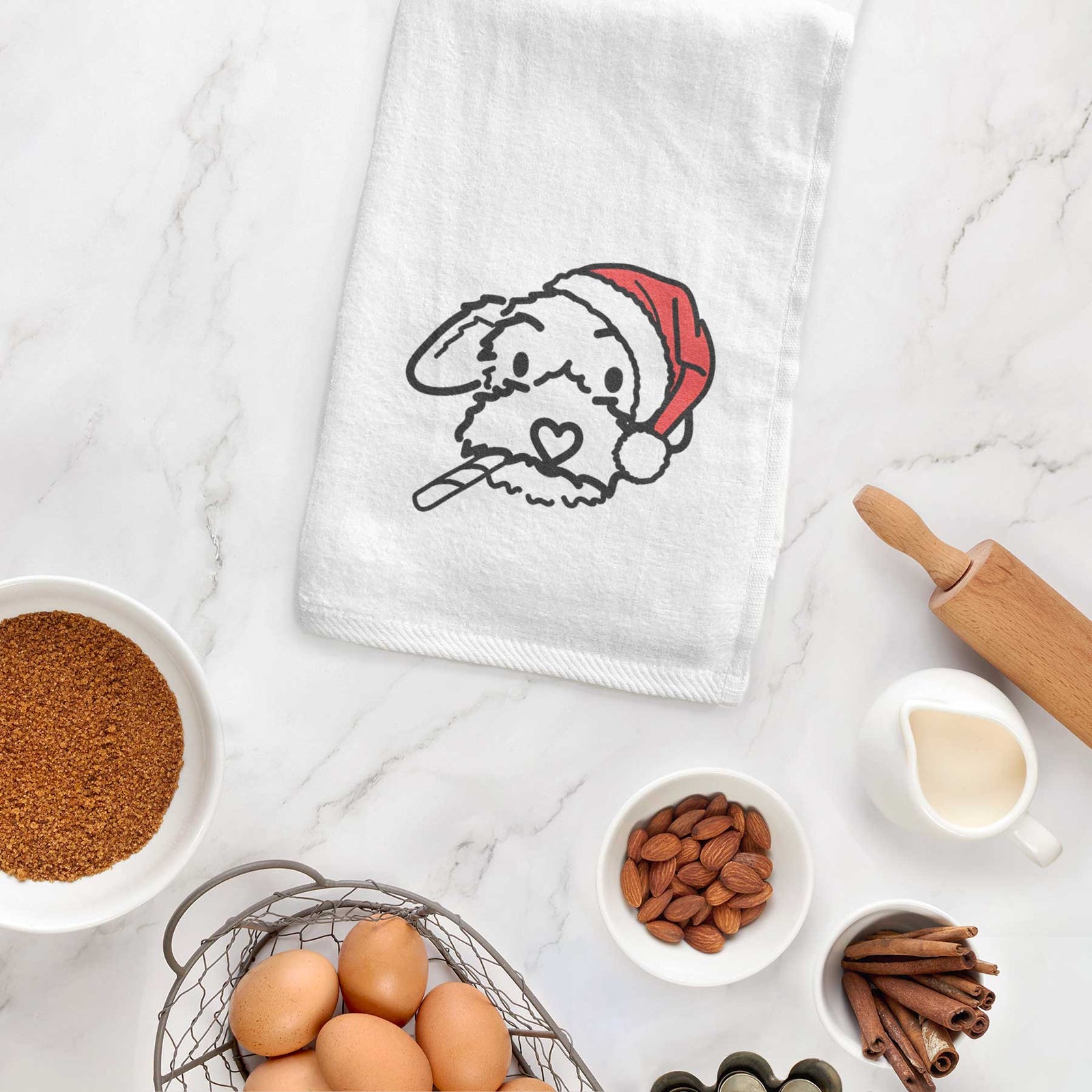 Minimalist line drawing of Gomer the Poodle Mix wearing a Santa hat on a decorative hand towel
