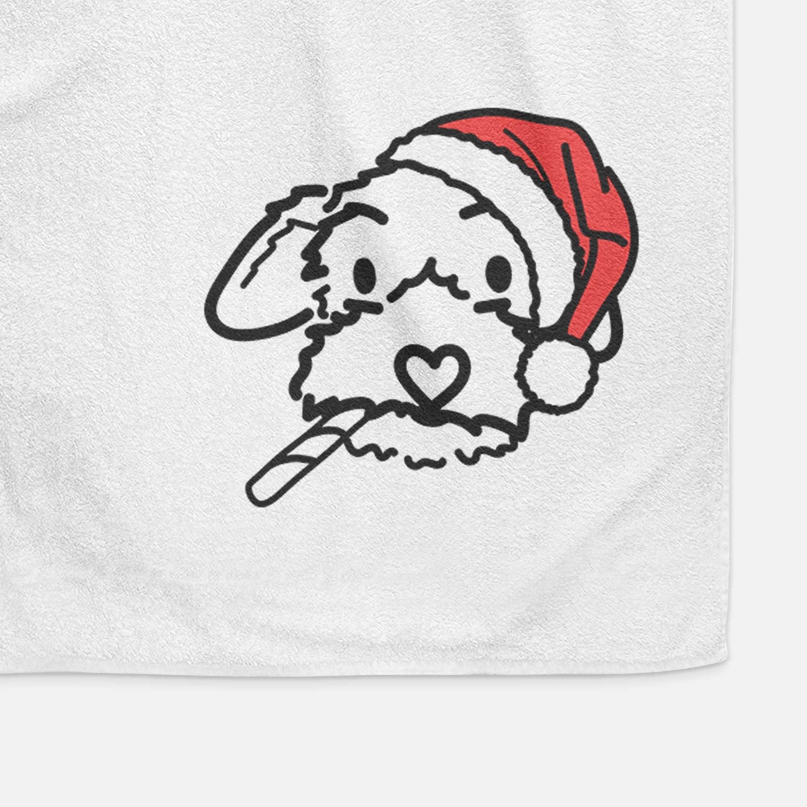 Minimalist line drawing of Gomer the Poodle Mix wearing a Santa hat on a decorative hand towel