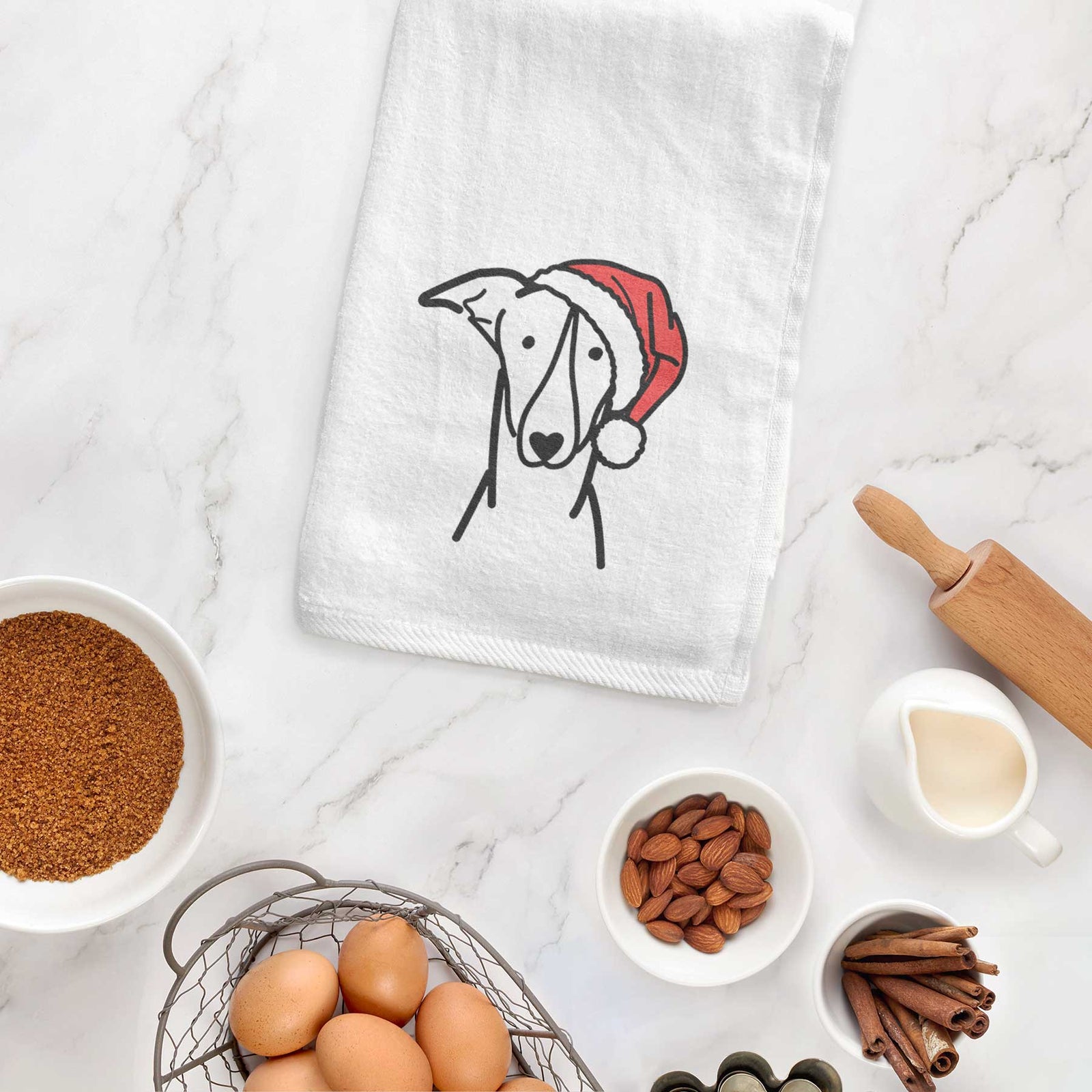 Minimalist line drawing of a Greyhound wearing a Santa hat on a decorative hand towel