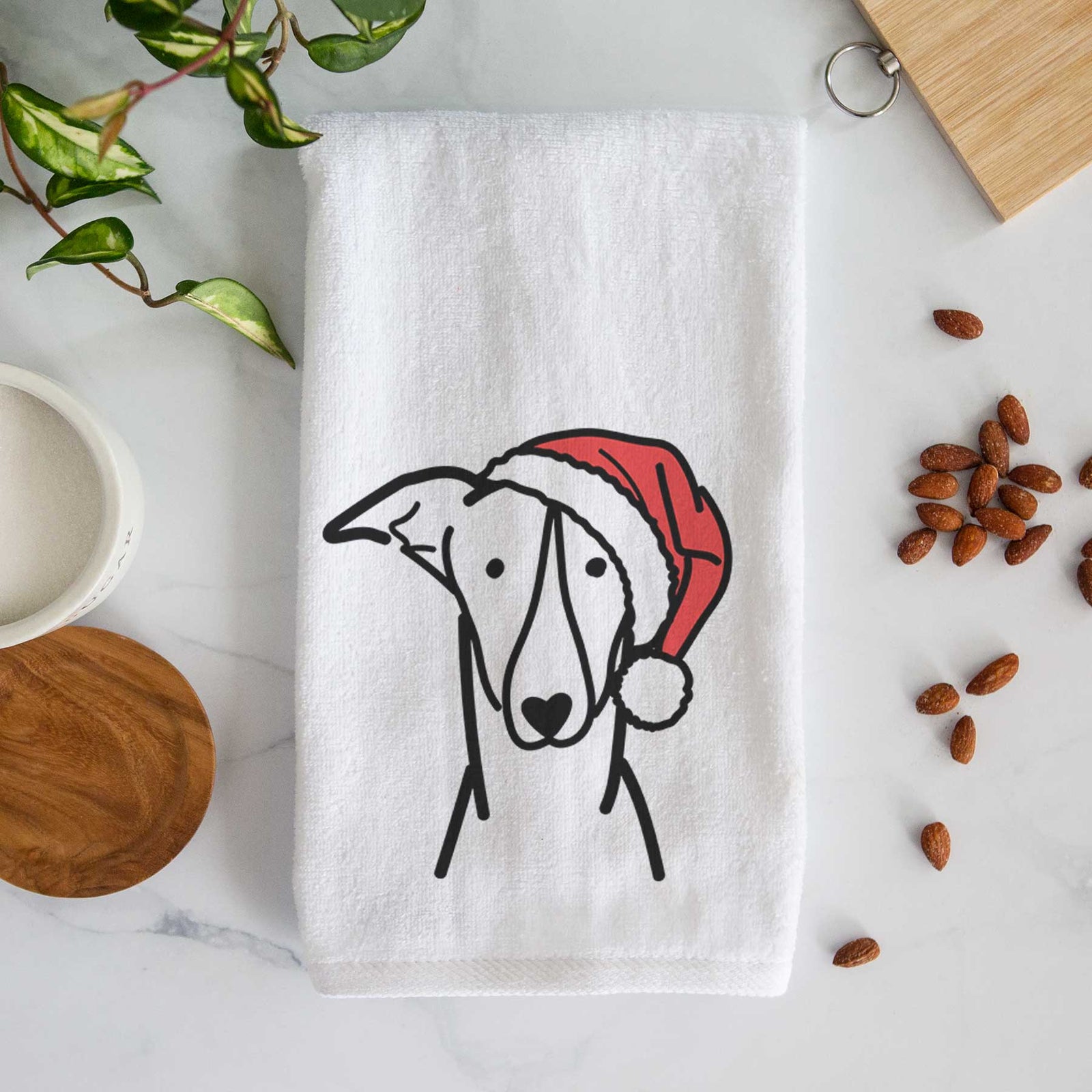 Minimalist line drawing of a Greyhound wearing a Santa hat on a decorative hand towel
