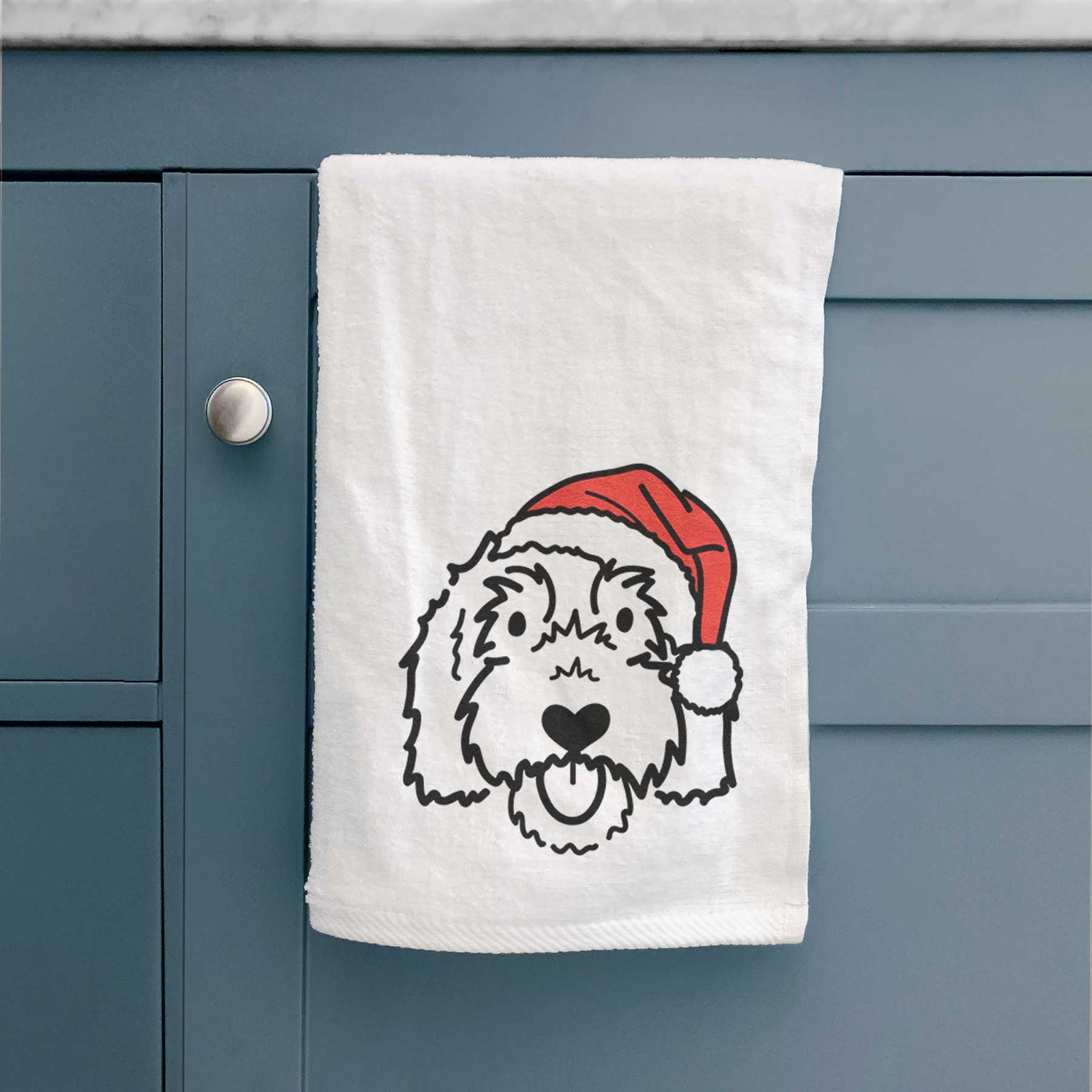 Minimalist line drawing of Gus the Goldendoodle wearing a Santa hat on a decorative hand towel