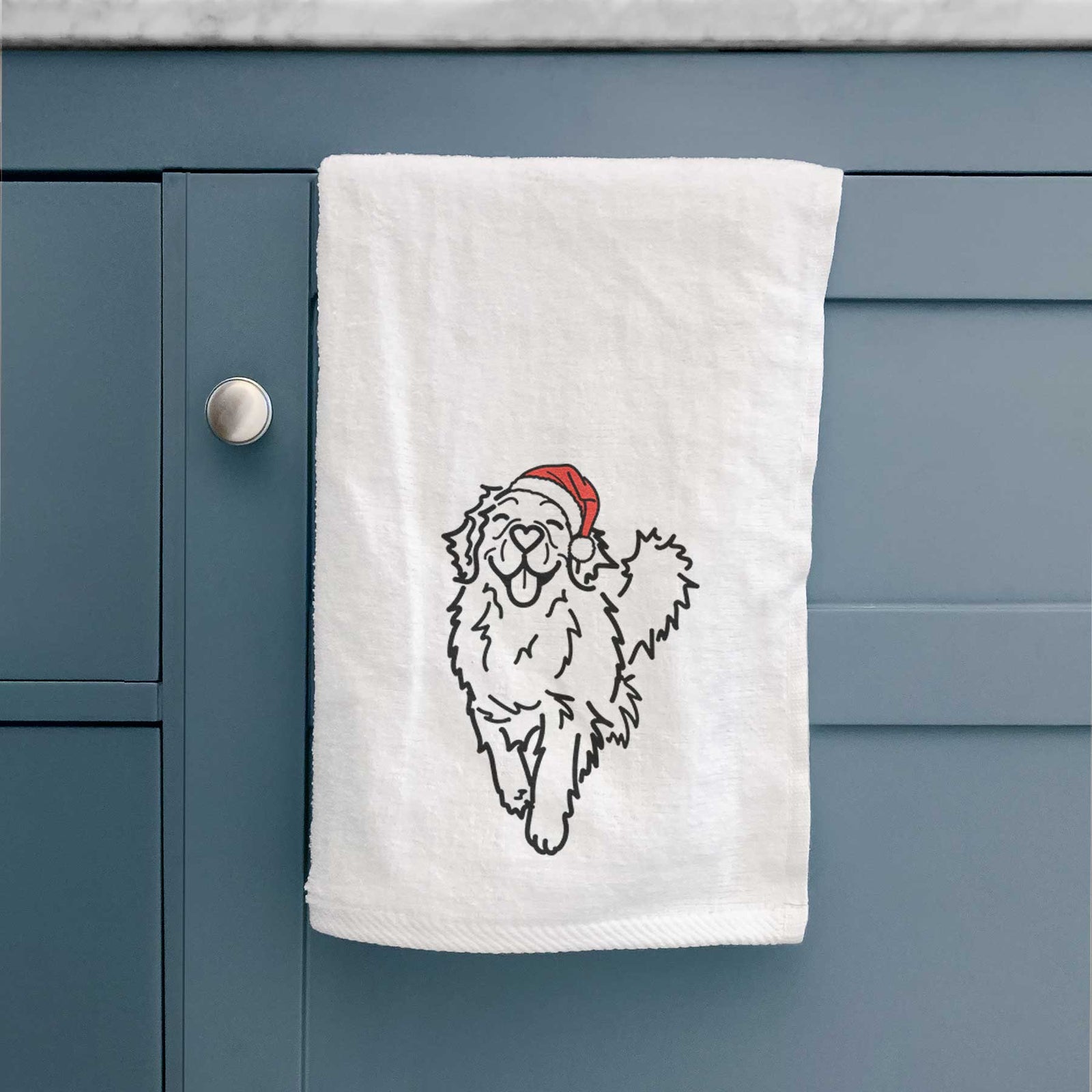 Minimalist line drawing of Hamlet the Golden Retriever wearing a Santa hat on a decorative hand towel