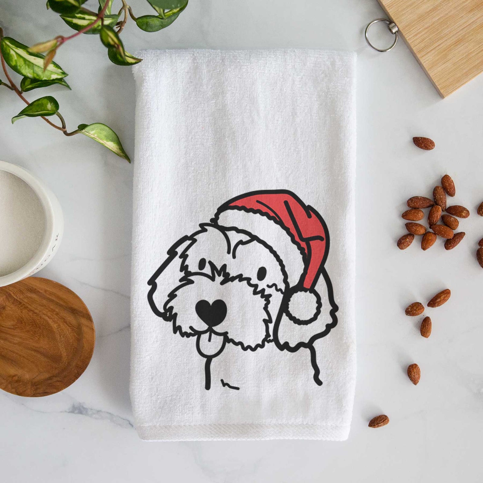 Minimalist line drawing of a Havapoo wearing a Santa hat on a decorative hand towel