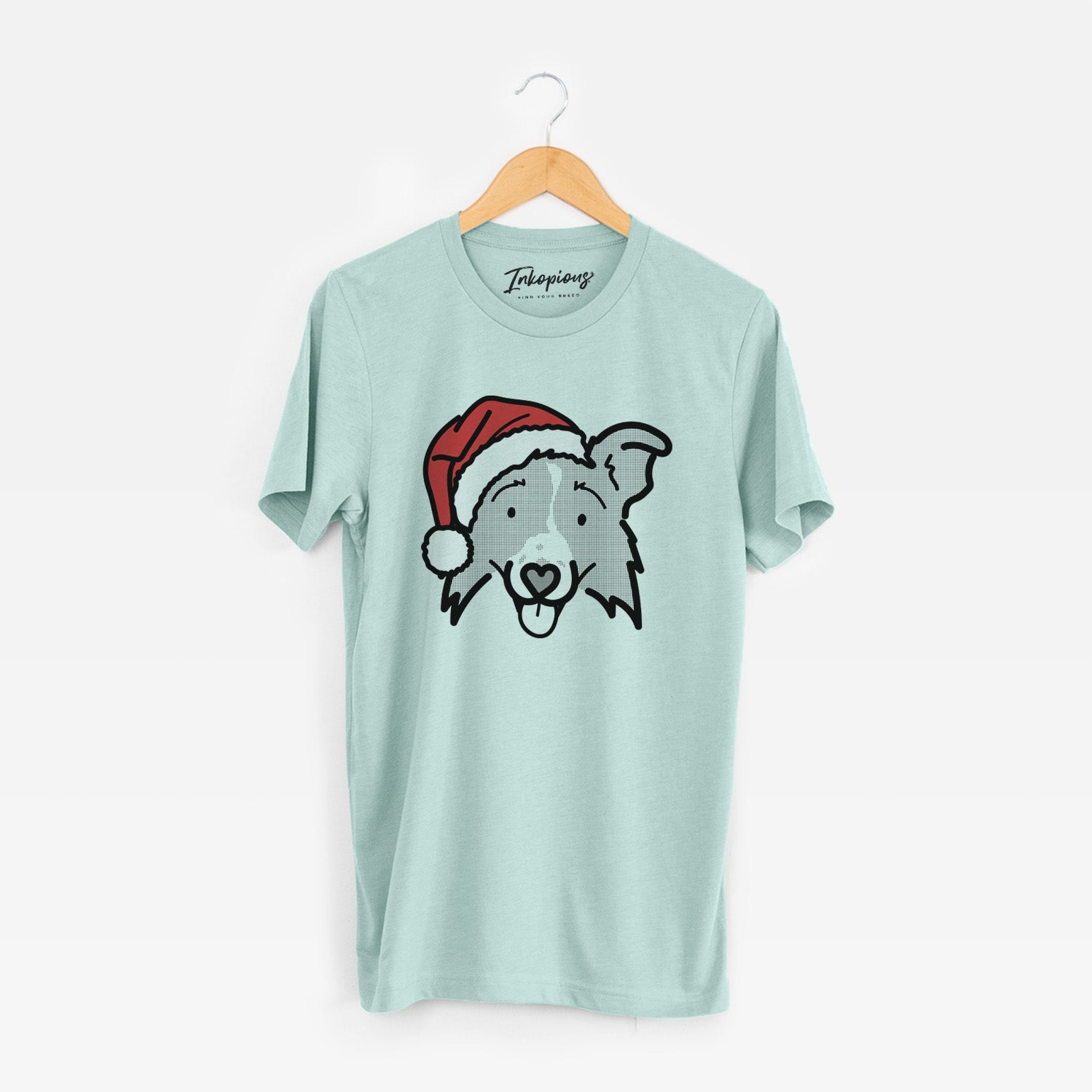 Minimalist line drawing of Jam the Border Collie 2.0 wearing a Santa hat on a Heather Sage Unisex crewneck