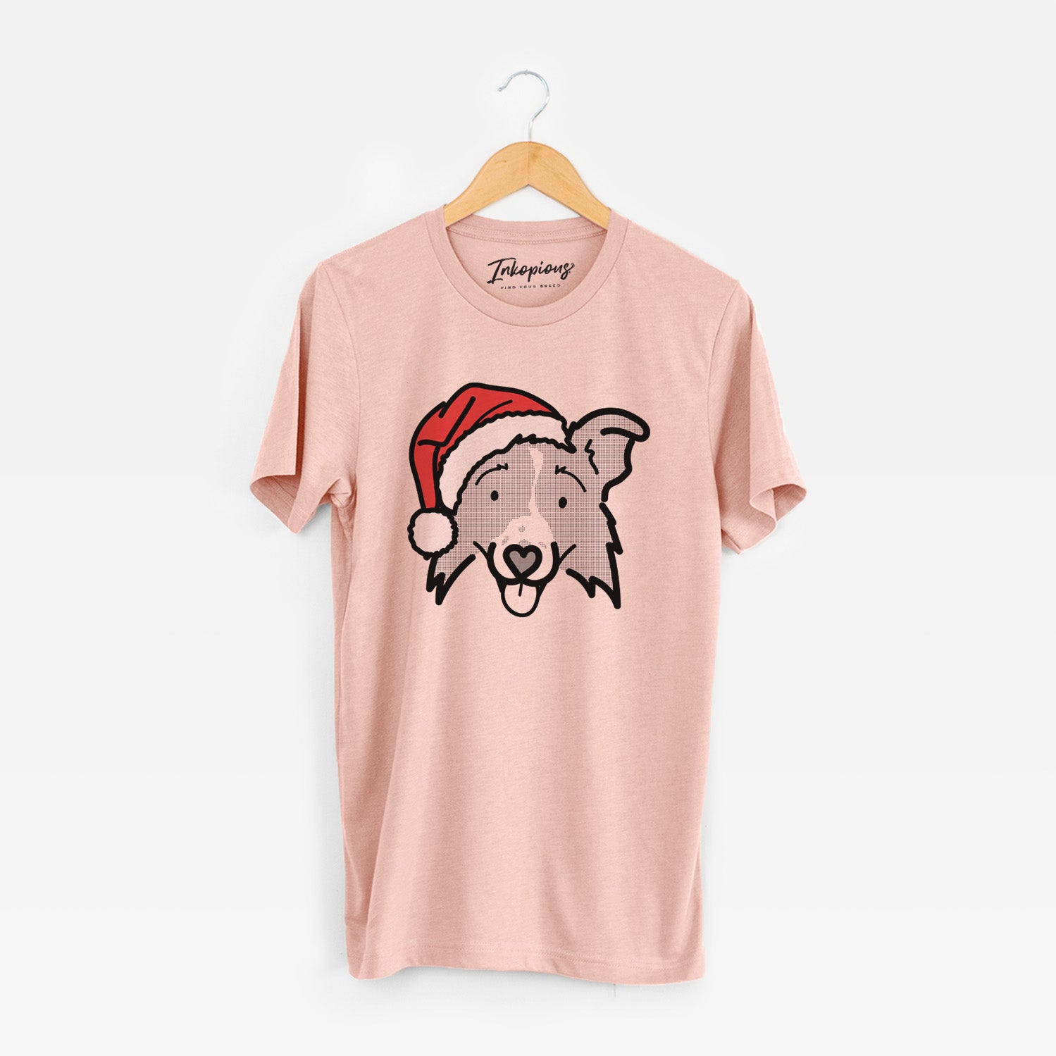 Minimalist line drawing of Jam the Border Collie 2.0 wearing a Santa hat on a Peach Unisex crewneck