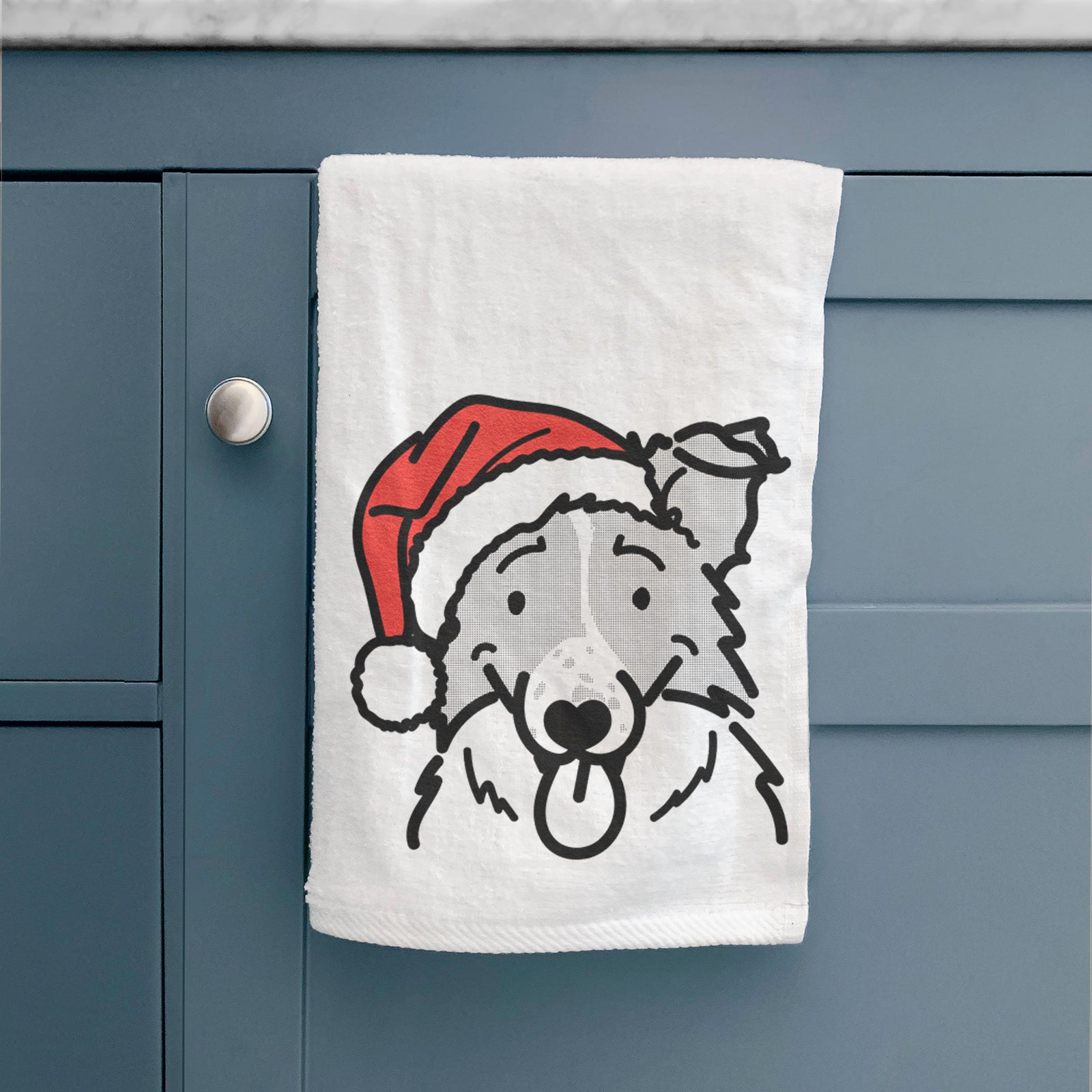 Minimalist line drawing of Jam the Border Collie wearing a Santa hat on a decorative hand towel